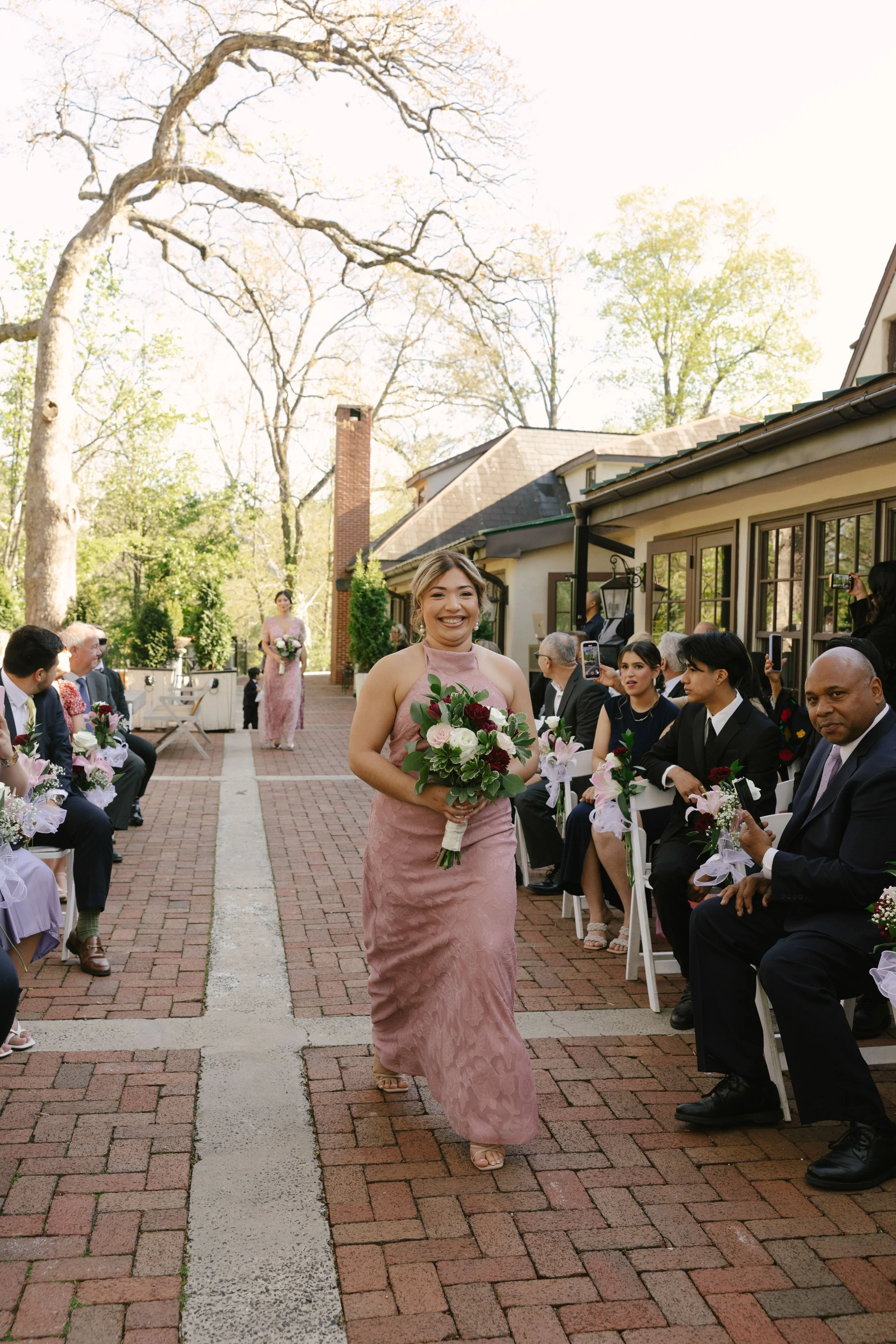 Outdoor wedding ceremony at Hotel DuVillage featuring the bride and groom, wedding party, and meaningful moments captured on both digital and 35mm film. A timeless celebration documented with a candid, documentary approach