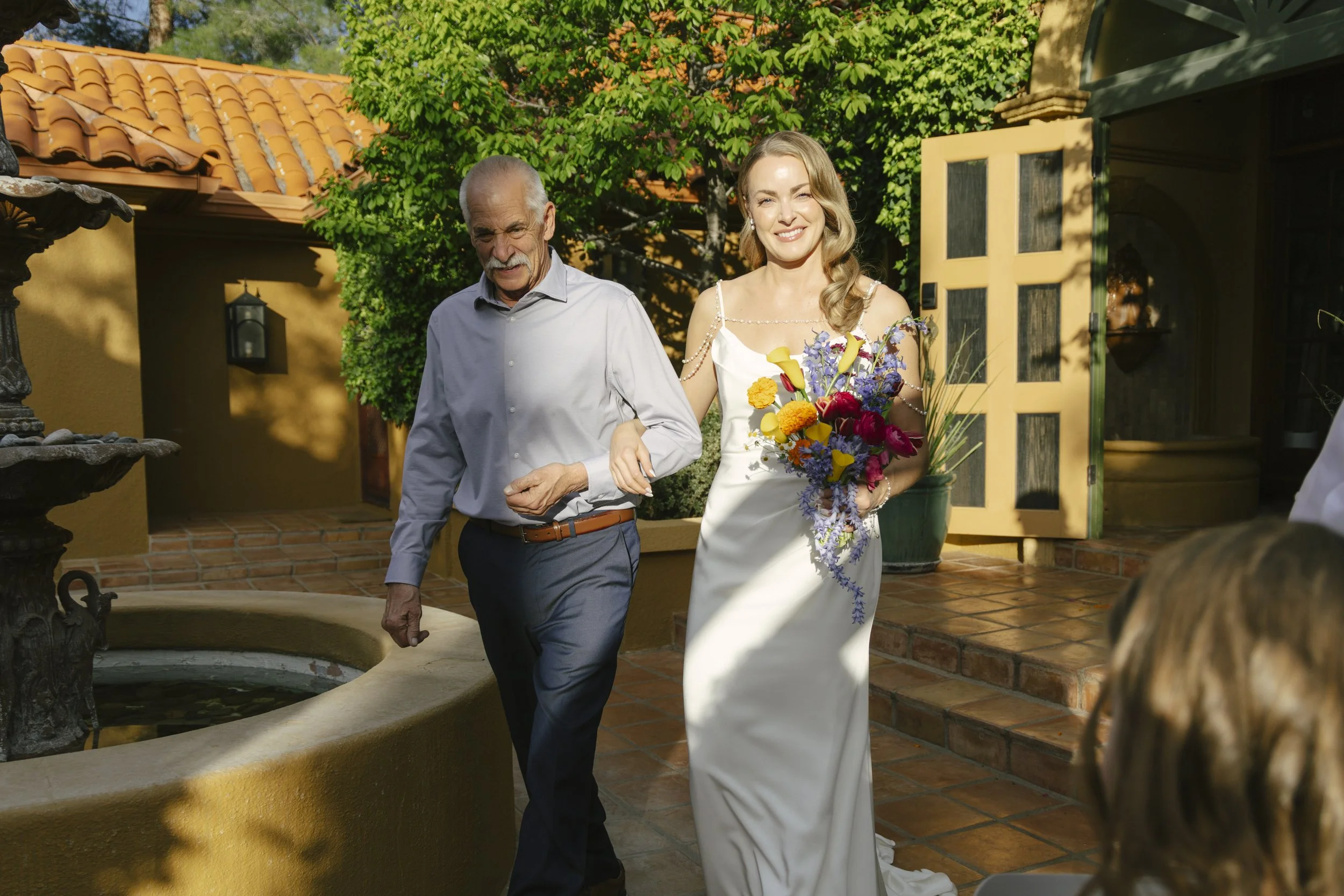 Chelsea and Travis exchanged heartfelt vows during their intimate Sedona elopement at a private Arizona home, surrounded by their closest family, friends, and beloved dog. Their outdoor ceremony was filled with meaningful moments, personal vows, and 