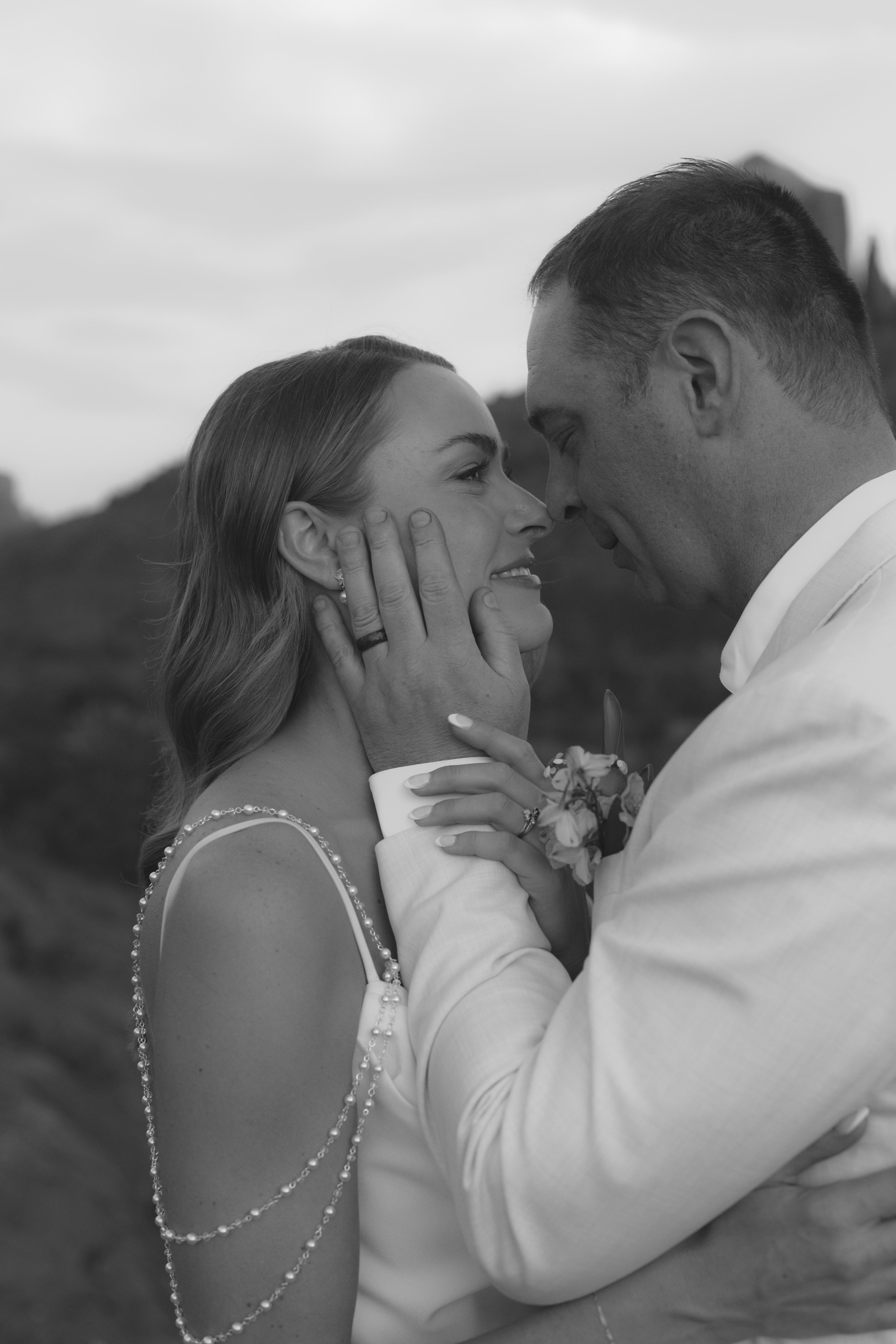 Romantic golden hour portraits at Secret Slick Rock during Chelsea and Travis' intimate Sedona elopement. Featuring Sedona's famous red rock views, stunning Arizona desert landscapes, and timeless wedding photography, these newlywed portraits perfect