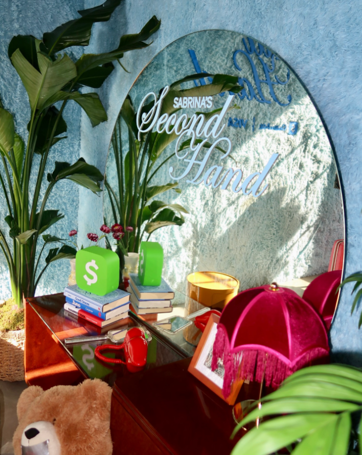Sabrina Carpenter Second Hand merchandise pop-up with Cash App and Visa branding at Garage Sale Vintage in Nashville.