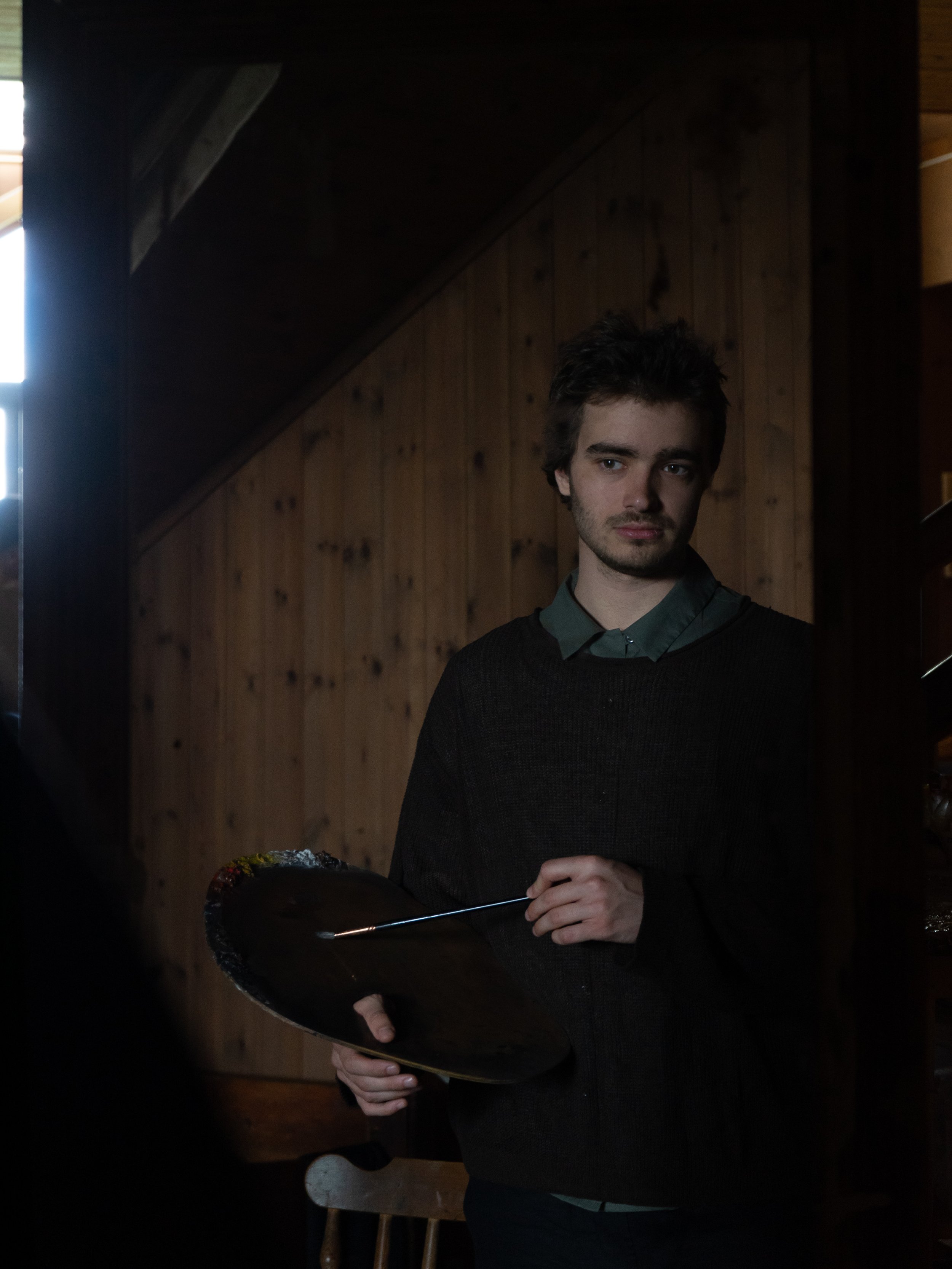 A photo of Fabrice Grimard Holding a Brush and his palette