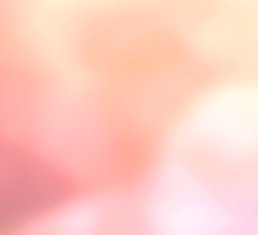 The image is blurred with soft pink, peach, and light beige colors, making it difficult to distinguish specific objects or details.