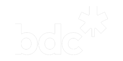 Black background with white lowercase letters spelling "bdc" and a white asterisk symbol to the right.
