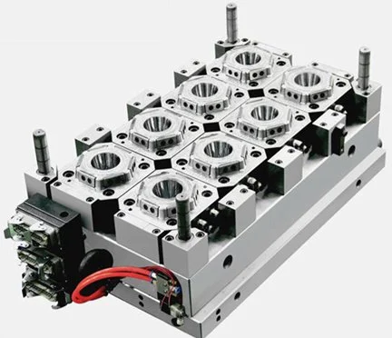 Mechanical component with multiple circular openings and hydraulic lines on a metal base.