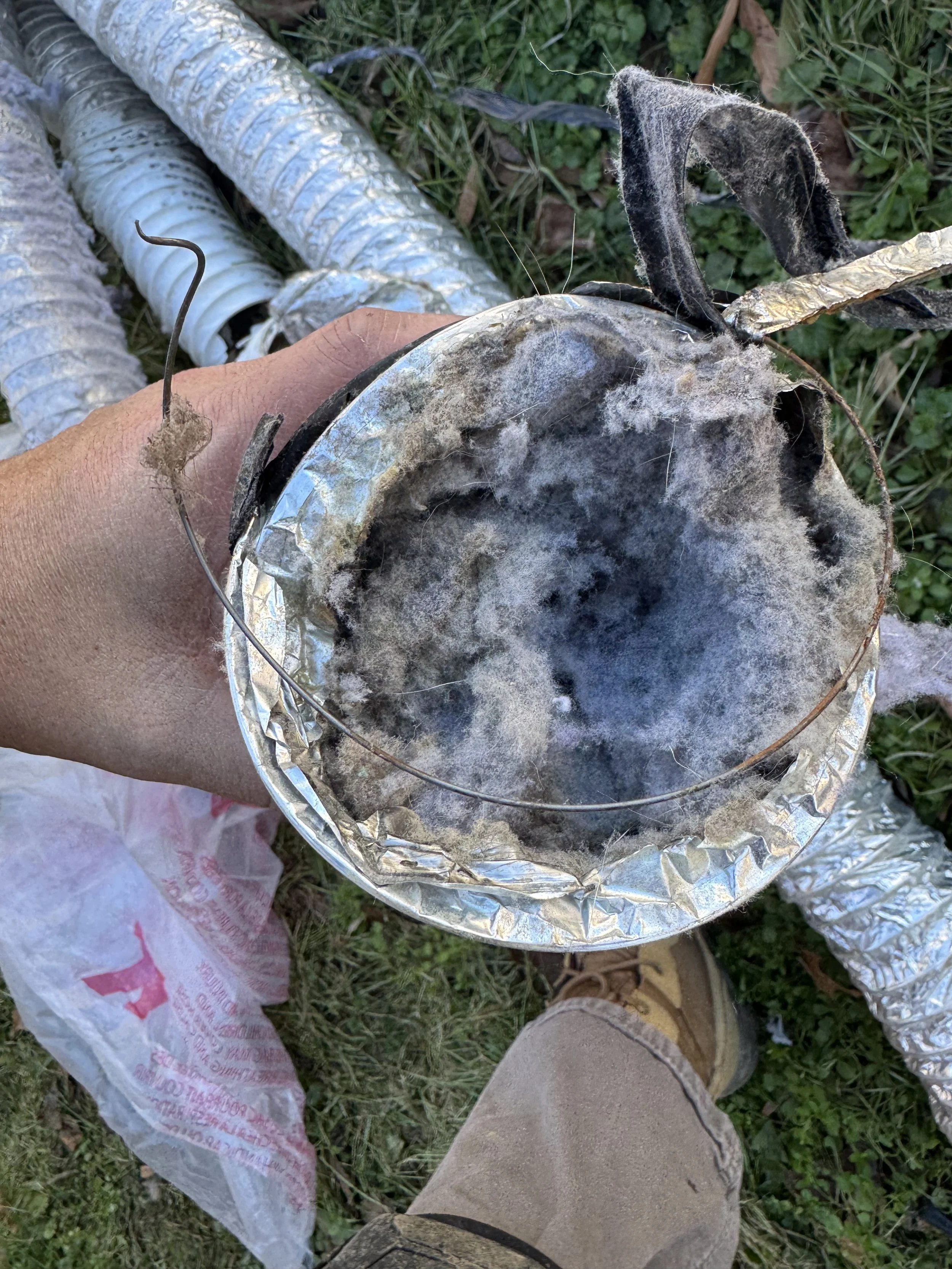 Flex transition vent pipe completely full. Customer had this pipe installed under their home. This was against local code and had came apart under the house. 