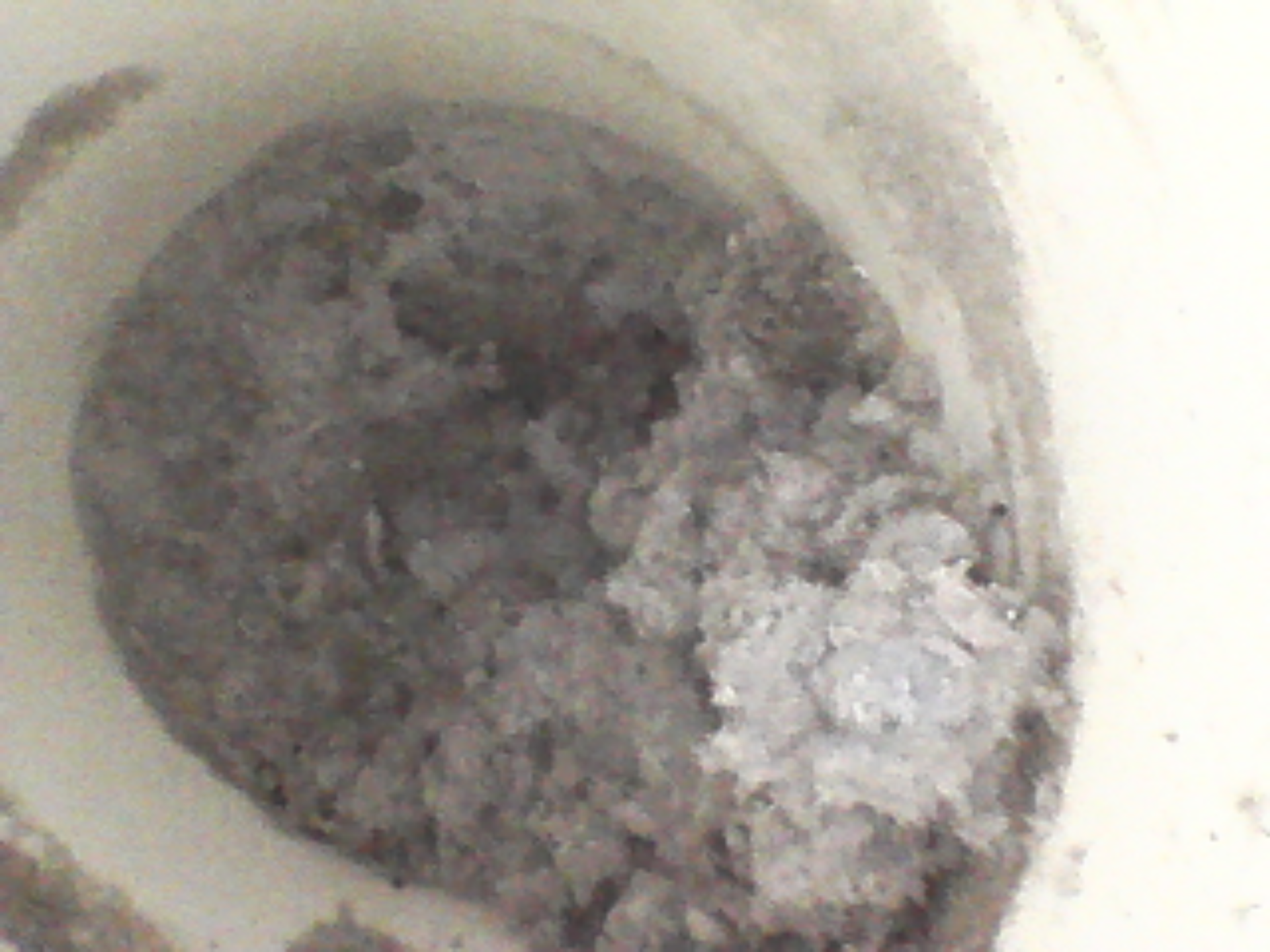 Close-up of a clogged dryer vent pipe.