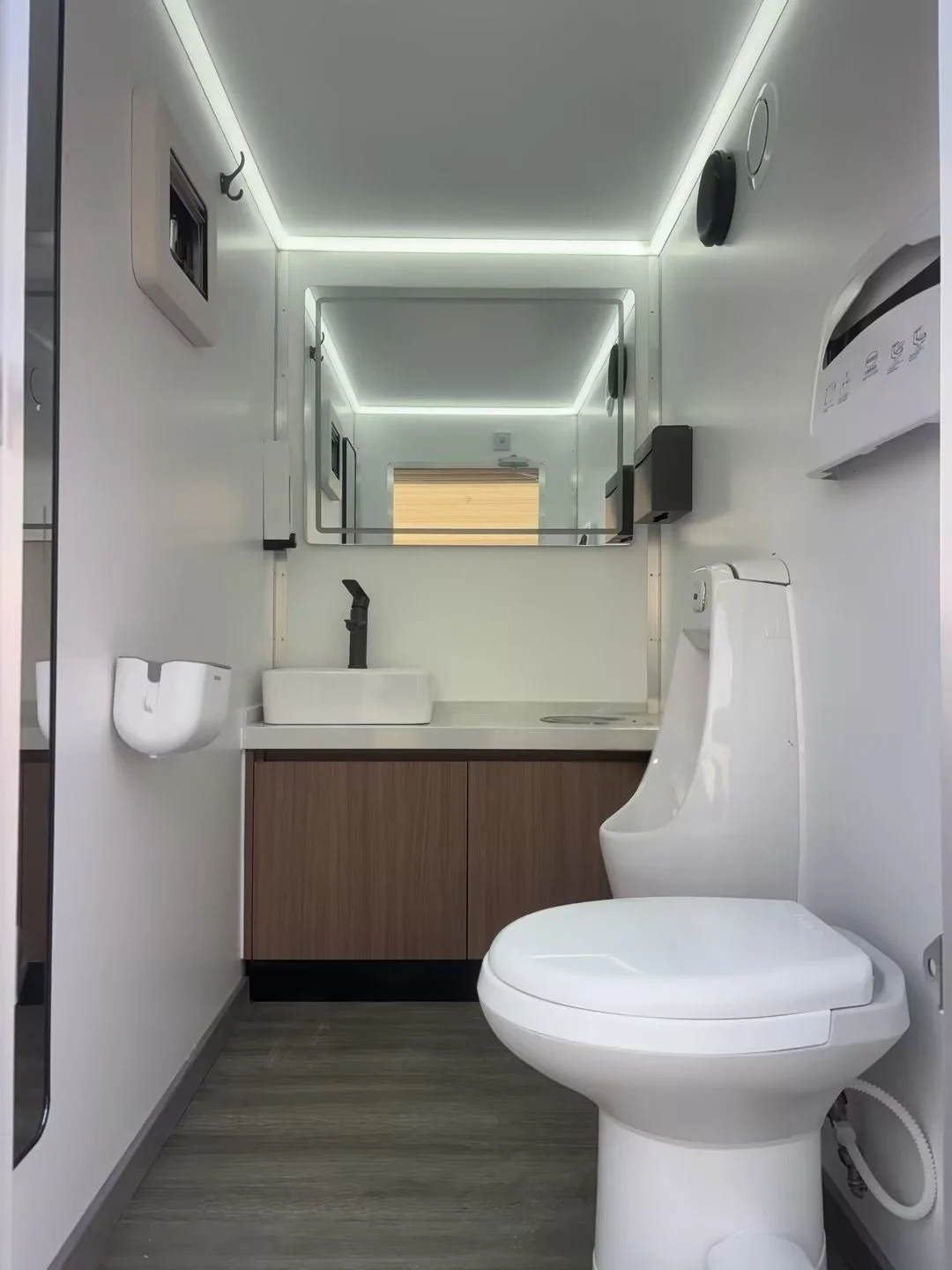 Mens modern toilet trailer with climate control and flushing toilets