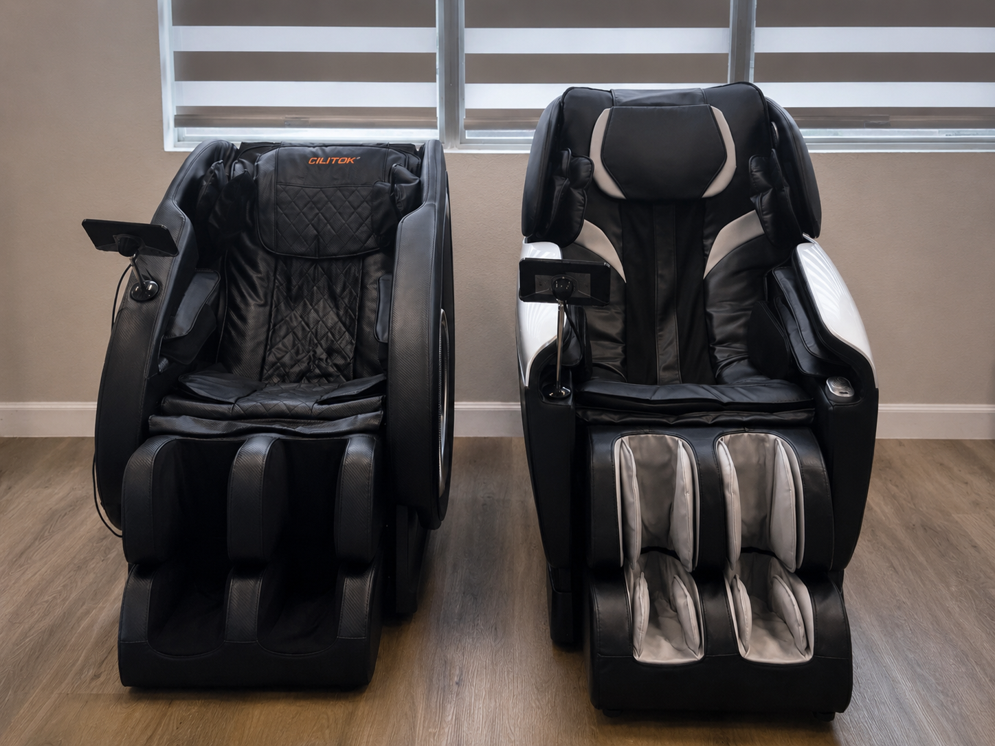 Two recovery massage chairs positioned side by side in the clinic recovery area.
