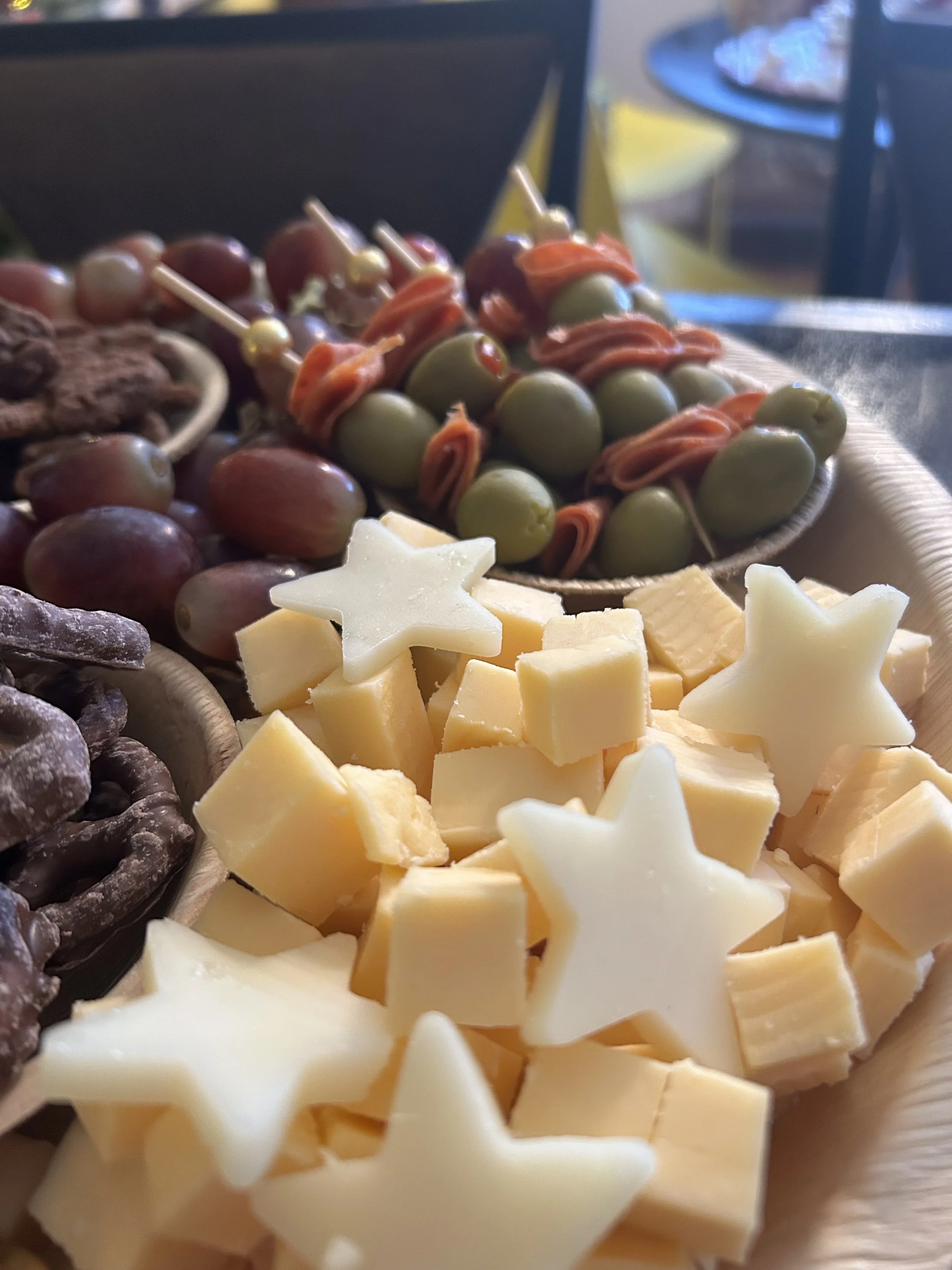 Modern charcuterie boards blending cheeses meats fresh elements and styling.jpg