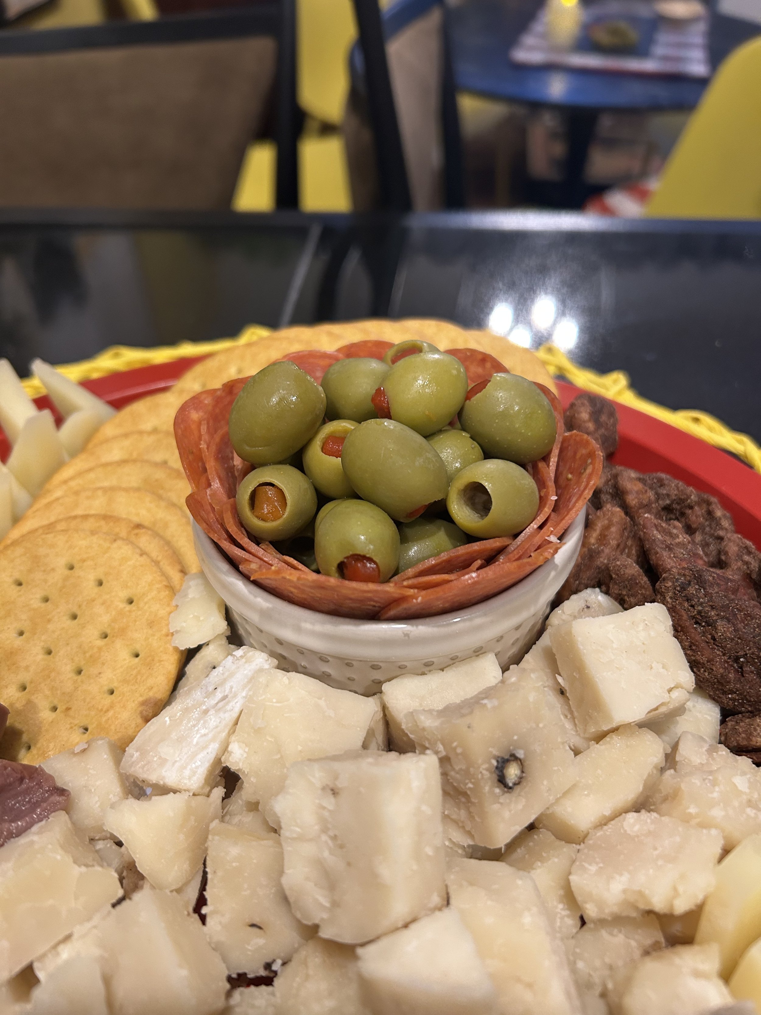 Artisan cheese selections alongside smoked meats nuts crackers and preserves.jpg