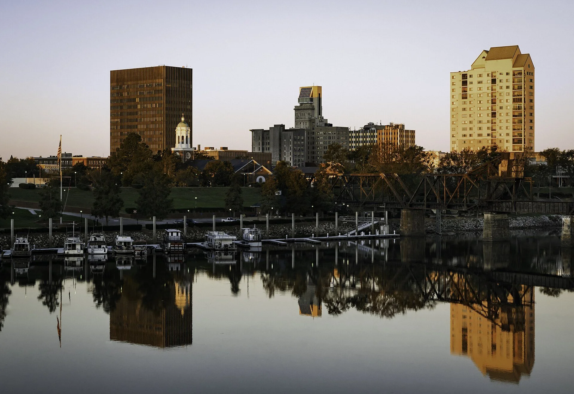Downtown Augusta, Georgia, reflected across the Savannah River at golden hour.