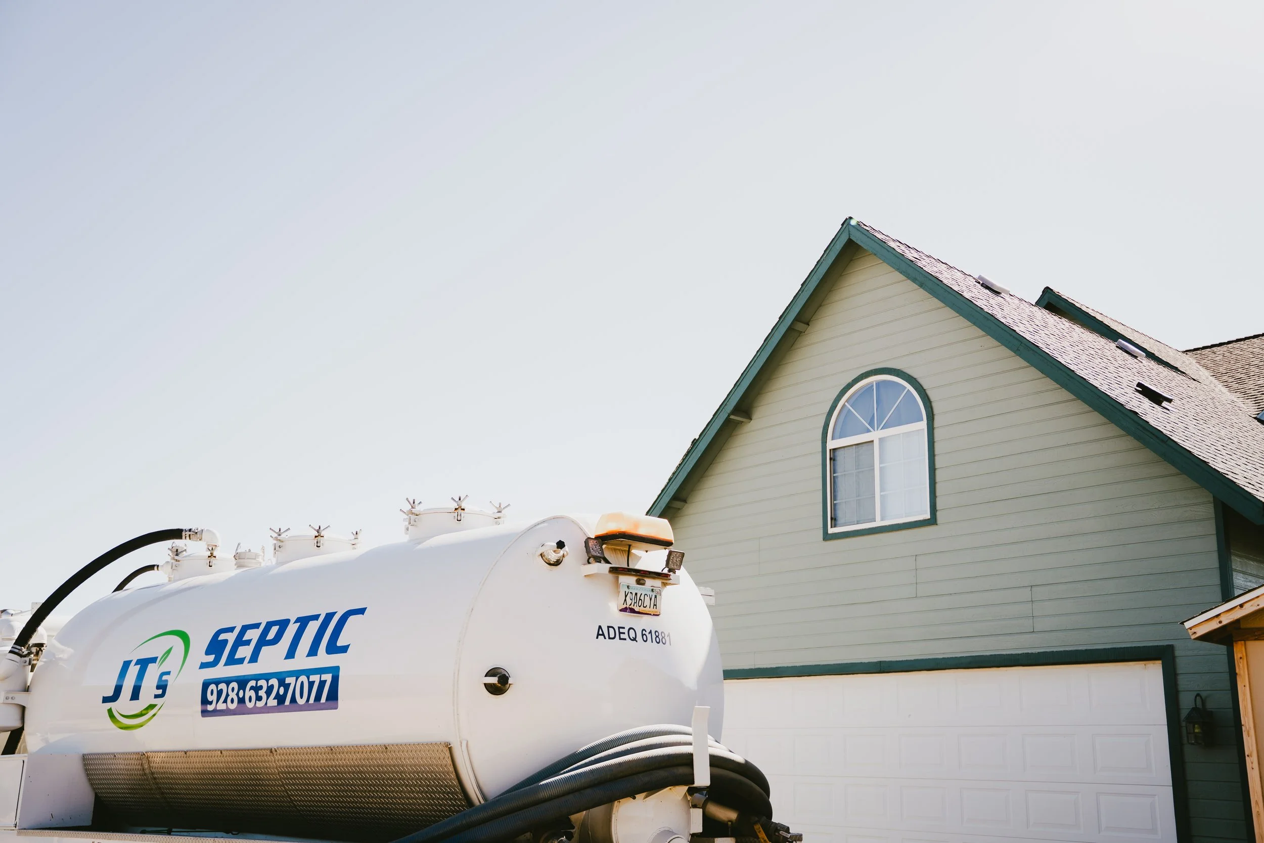 Jt's Septic arriving at a home to provide it's exceptional septic maintenance services.