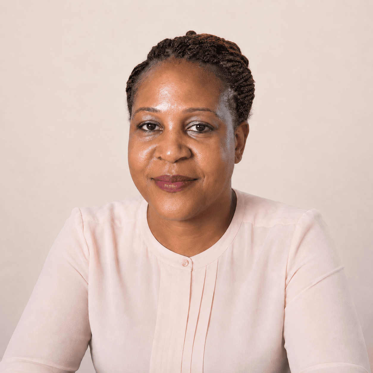 Professional photo of Angela Degazon, certified newborn care specialist at Little Angel Doula Care.