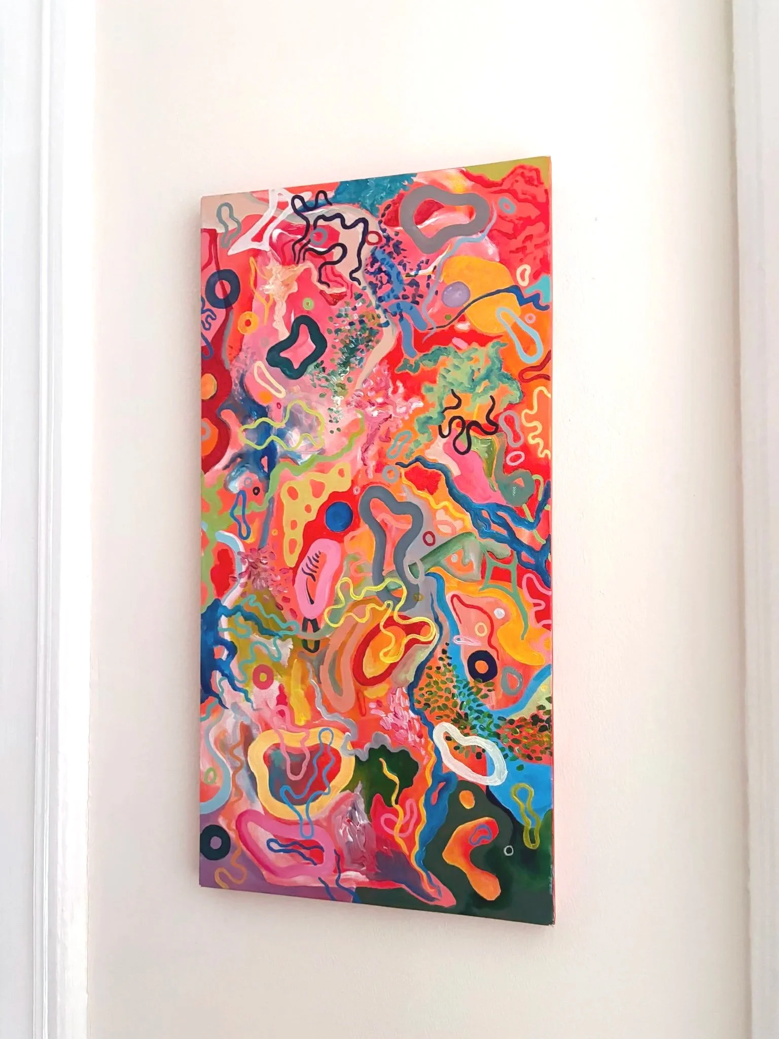 (installed) Ah, ha! (2021). Acrylic on canvas. 12" x 24". Available in shop.