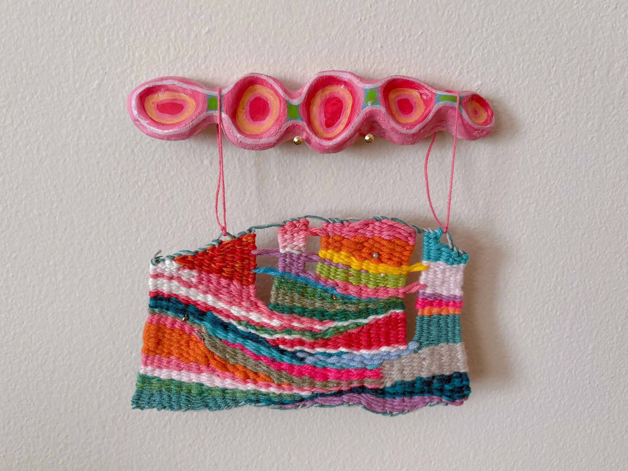 Landscape (2025). 6.25" x 6.5" x .75". Yarn, thread, clay, acrylic paint, beads, glue. NFS.