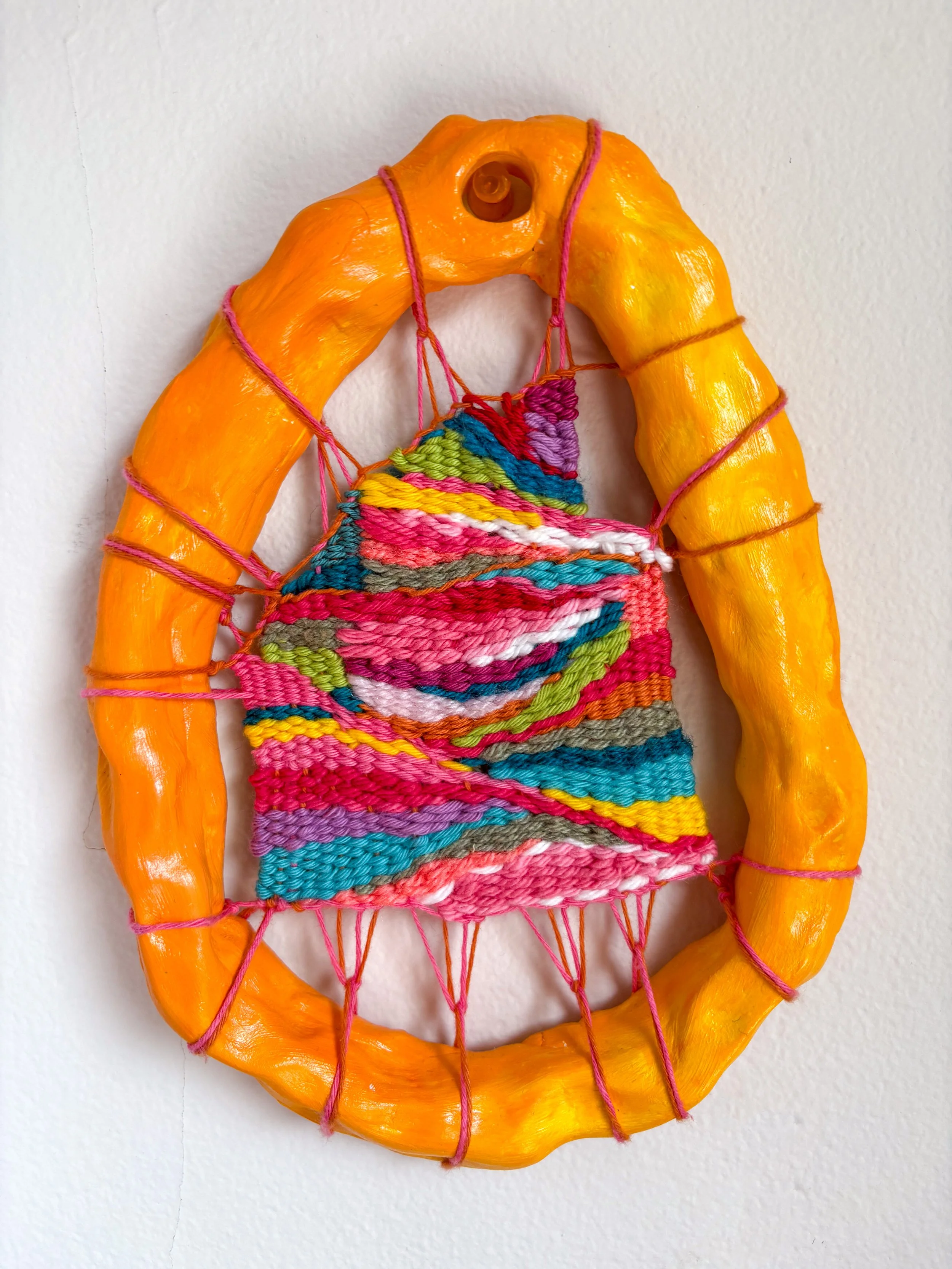 Yellow Portal (2025). 5.5" x 8" x 1". Thread, yarn, clay, acrylic paint, and glue. SOLD.