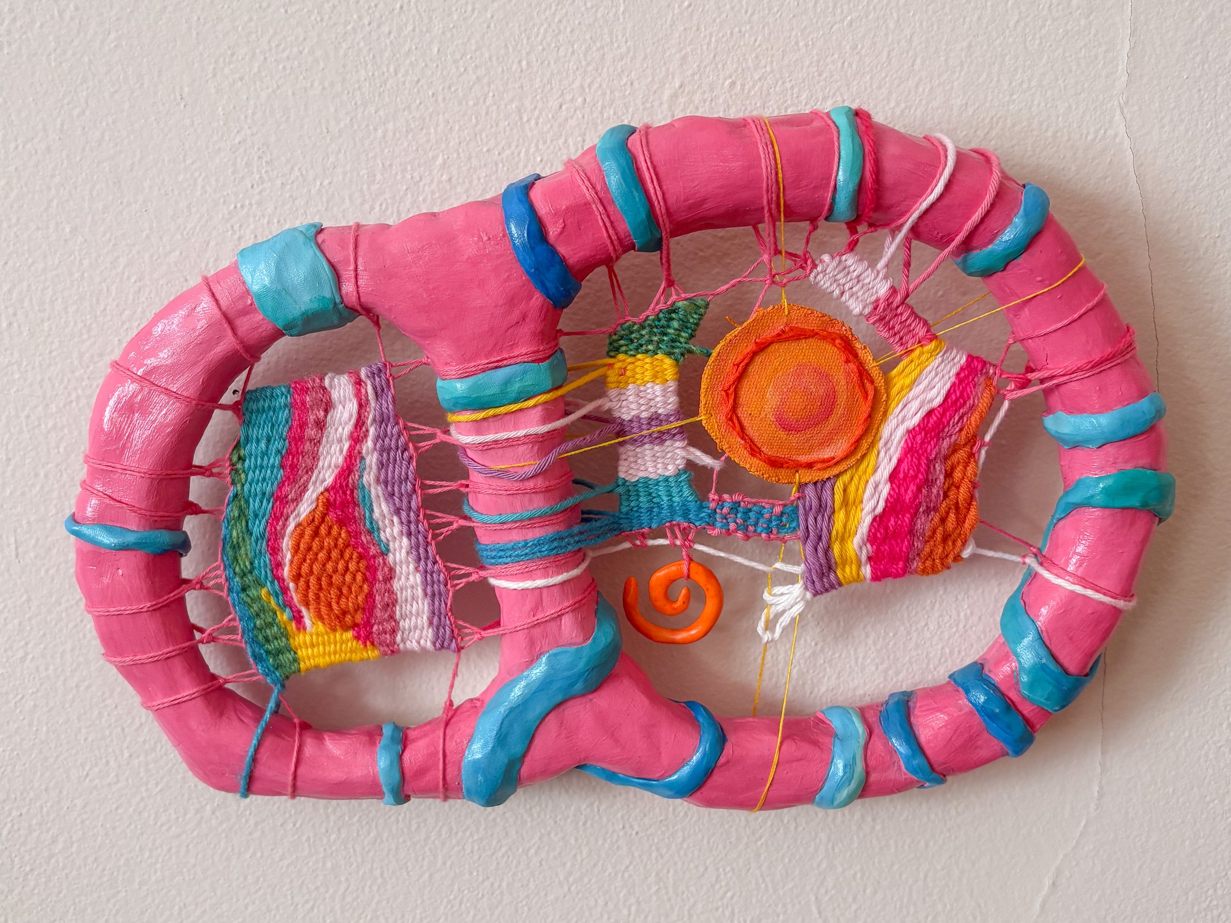 Whimsy (2025). 12" x 8" x 2". Yarn, thread, clay, acrylic paint, beads, glue, canvas, dried herbs (lavender, calendula, rose petals, rosemary).