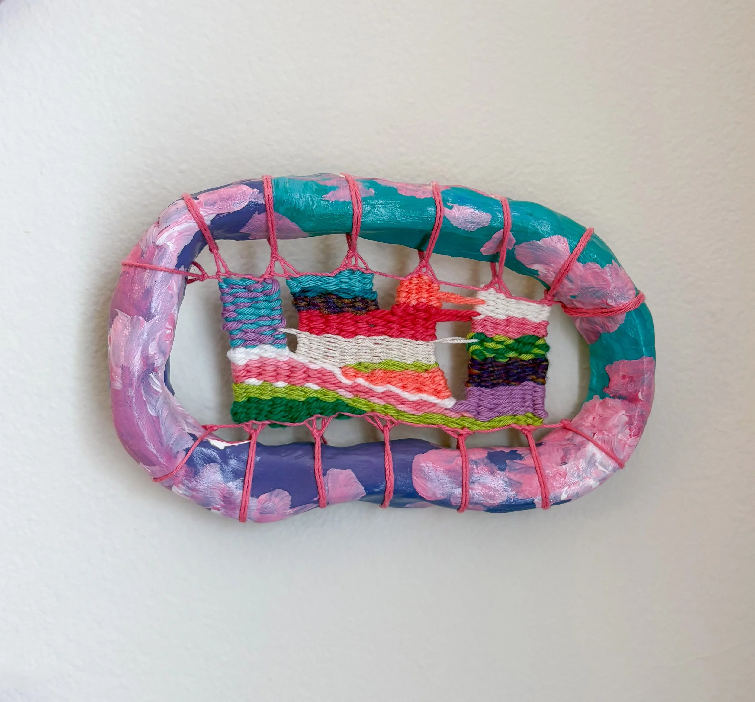 "Rococo paintings and falling pink rose petals and ripe strawberries topped with whipped cream." --- Rococo (2025). 4” x 6.5” x 1.5". Thread, yarn, clay, acrylic paint, and glue. NFS.