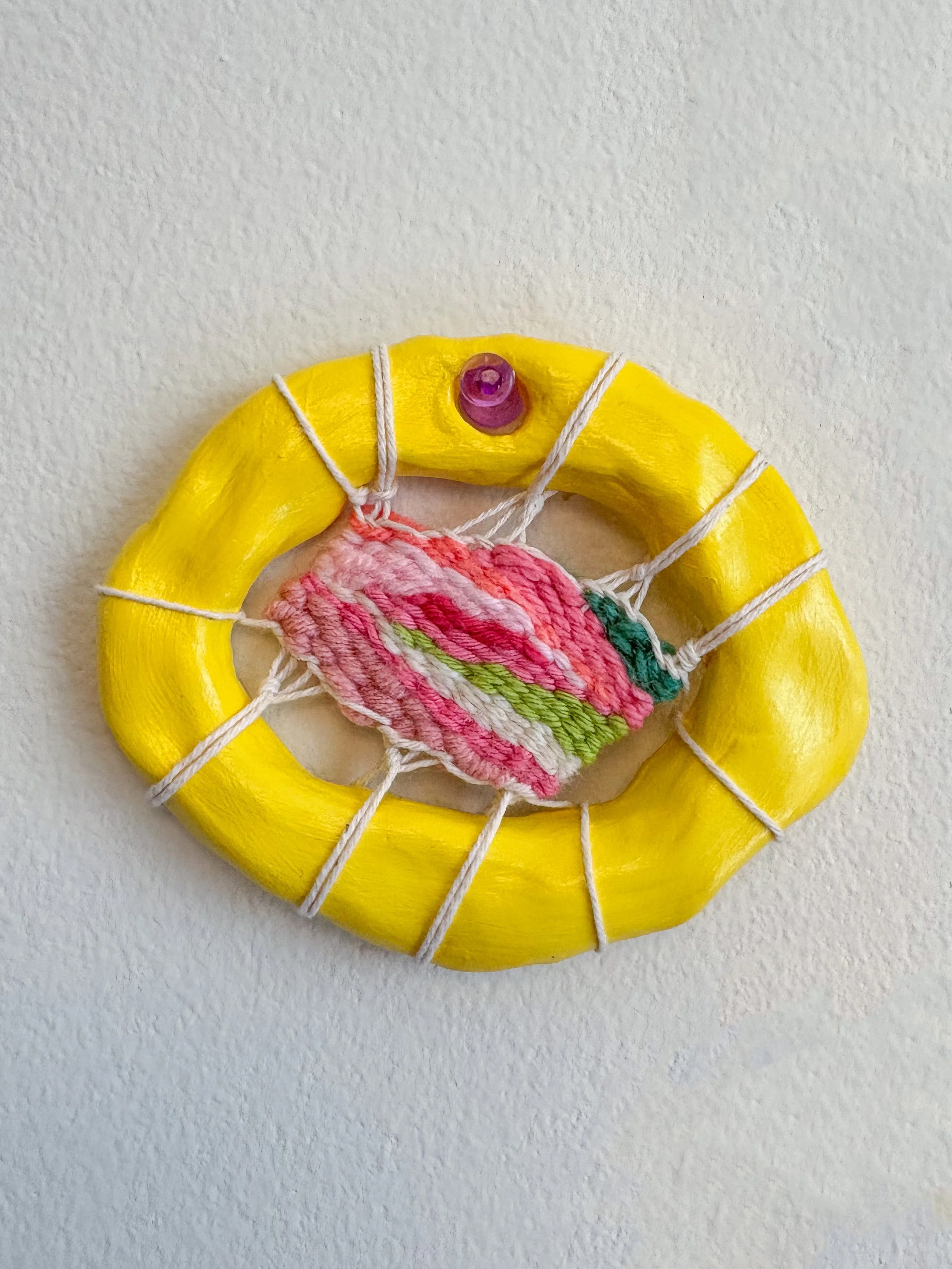 "A cool summers day, a thick pad of half-melted butter atop a huge stack of diner pancakes." --- Butter Yellow (2025). 4" x 3.25" x .75". Thread, yarn, clay, acrylic paint, and glue. Available in shop.
