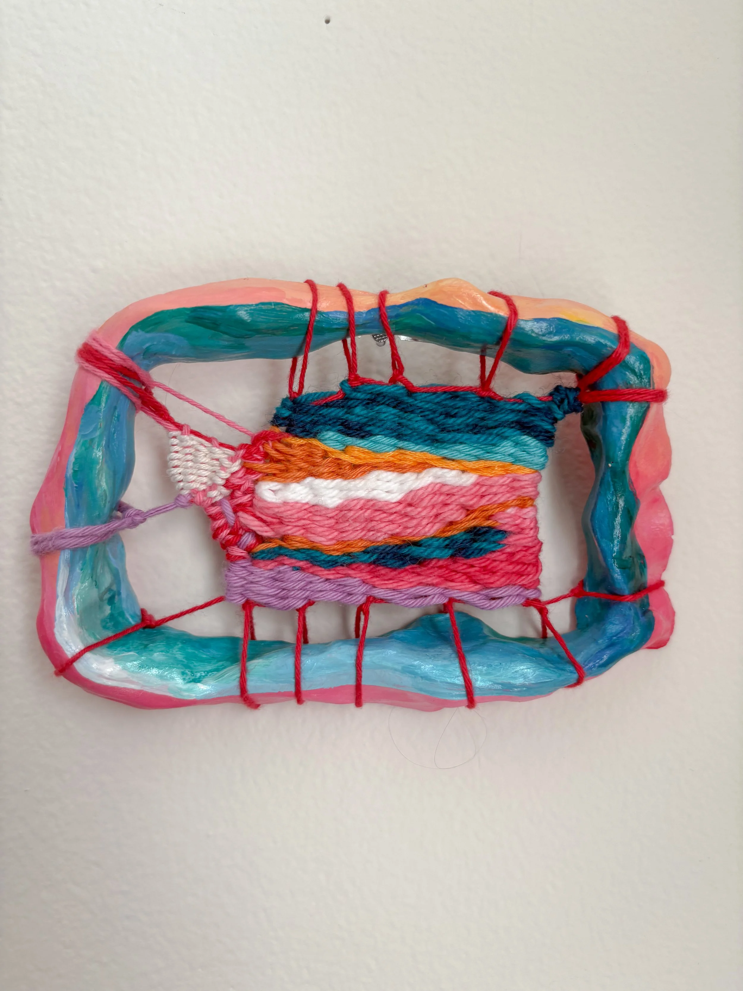 Emerging (2025). 3.5" x 5" x 1". Thread, yarn, clay, acrylic paint, and glue. NFS.