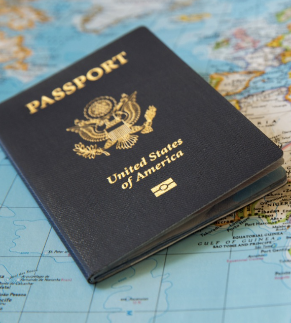 U.S. passport resting on a world map.