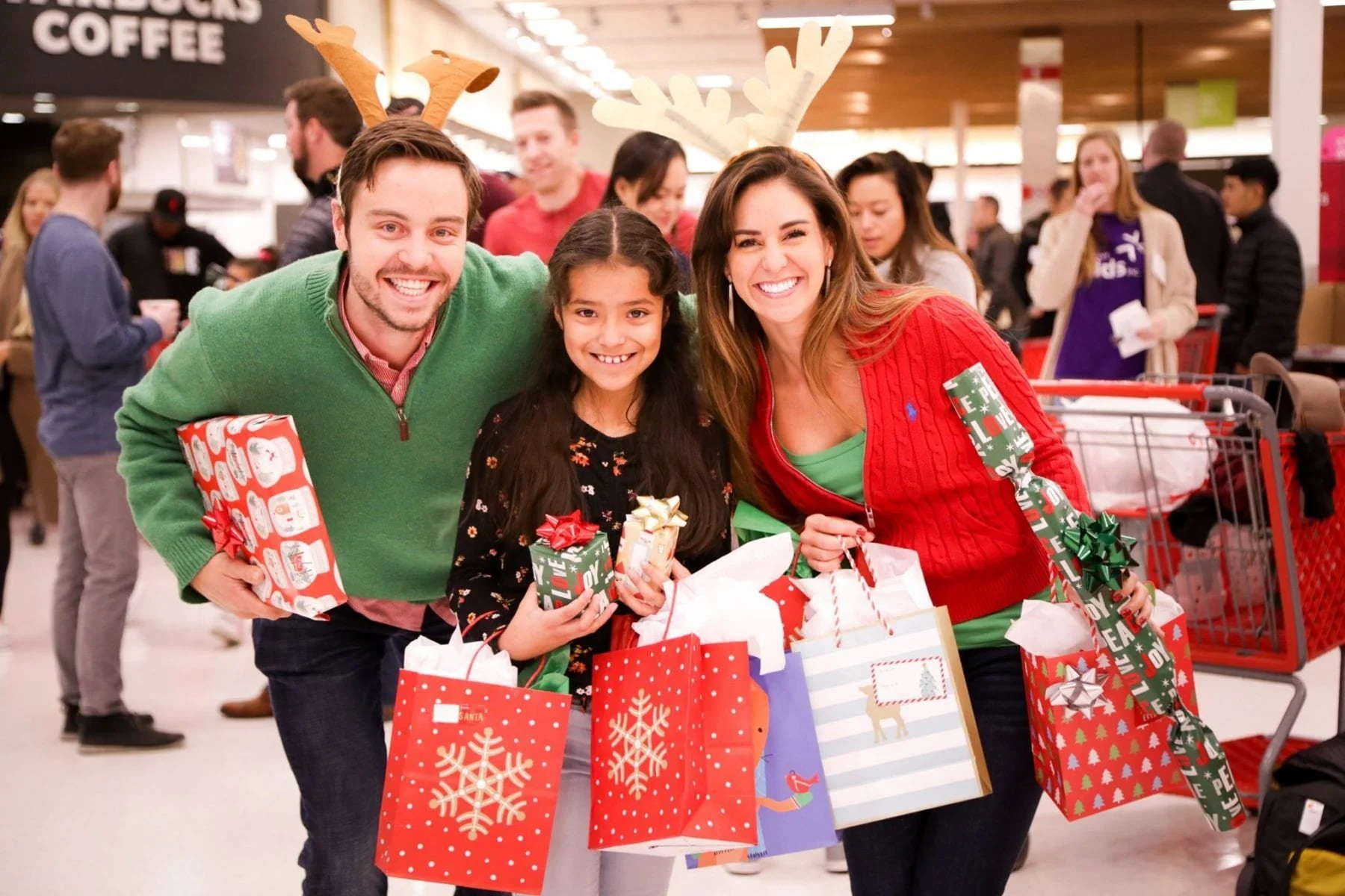Family receiving holiday gifts through the Denver Children’s Foundation Christmas for Kids program