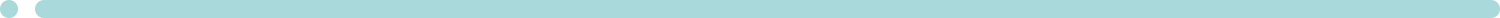 A pale blue object with a small bead or button on top, possibly a part of clothing or a decorative item.