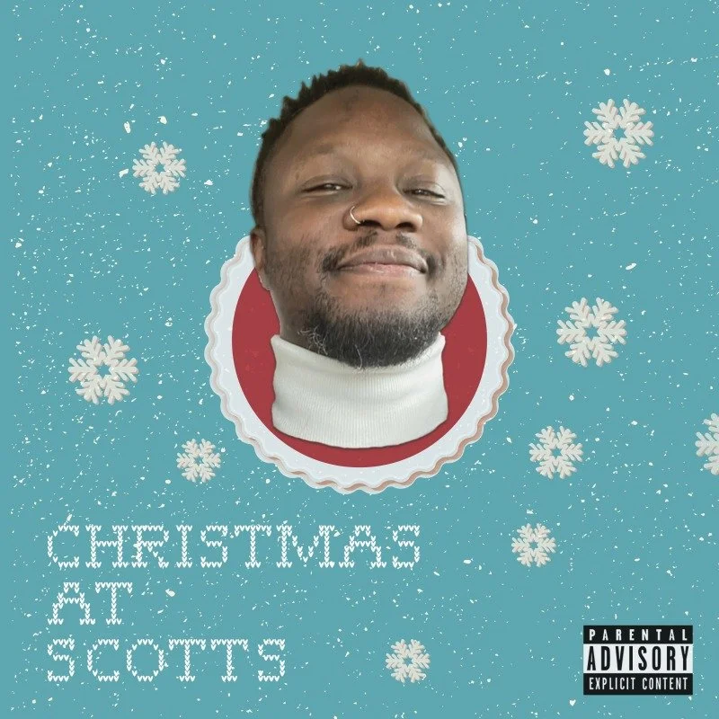 Album cover for "Christmas at Scotts" A man smiling with a nose ring, wearing a white turtleneck, surrounded by snowflakes, on a Christmas-themed background. Text reads "Christmas at Scott" and there is a parental advisory label.