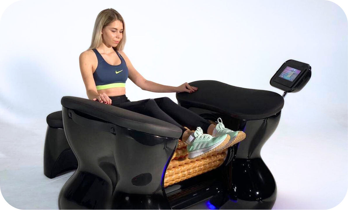 A woman using a foot-operated massage chair with a textured cushioned section for foot therapy, in a studio setting.