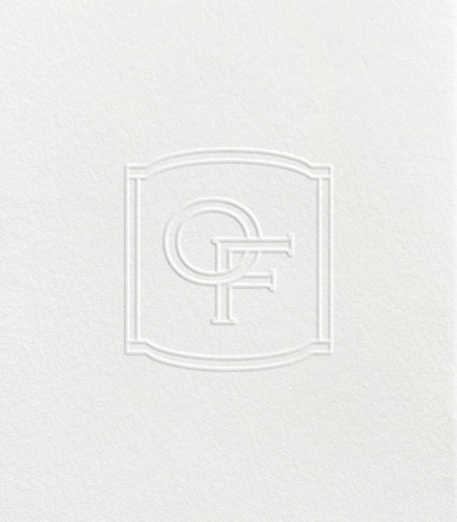 Embossed logo with the letters G and F intertwined inside a square border on a textured white background.