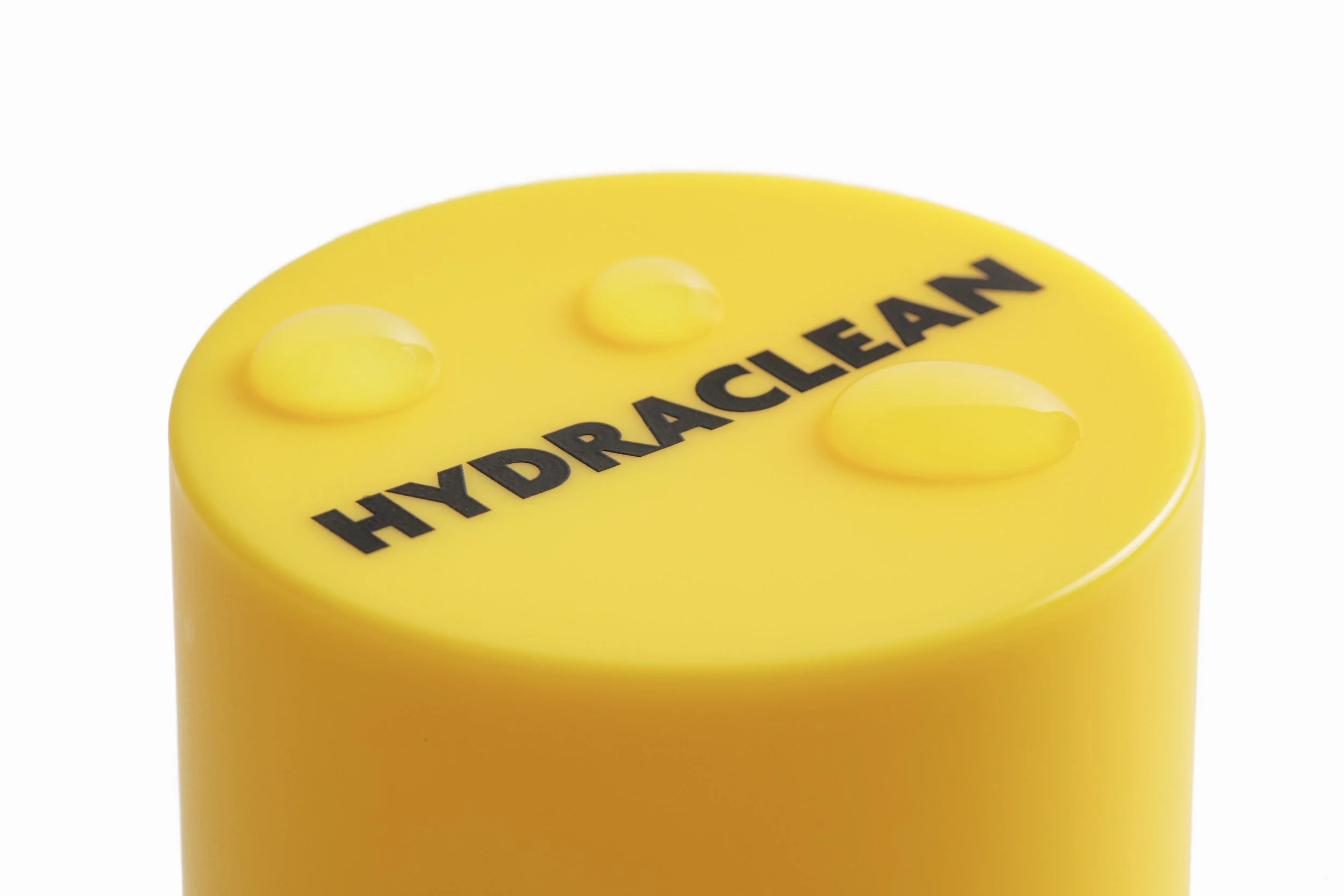 Close-up of HYDRACLEAN Daily Skin Mist yellow cap and bottle detail