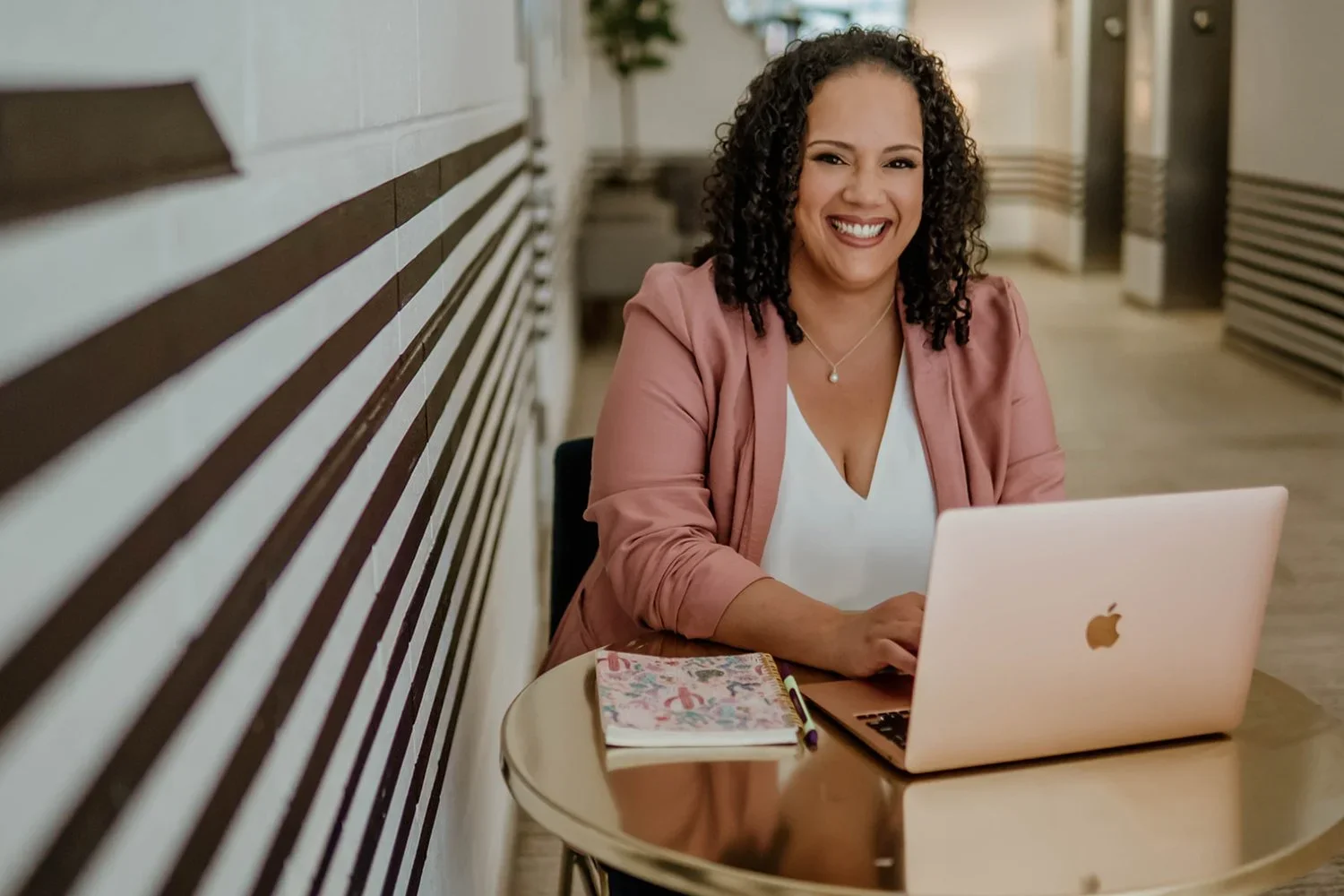 Yari Ising wearing a pink blazer & smiling at the camera, Founder of My Favorite Cleaning Co., offering cleaning services for Lehigh Valley PA