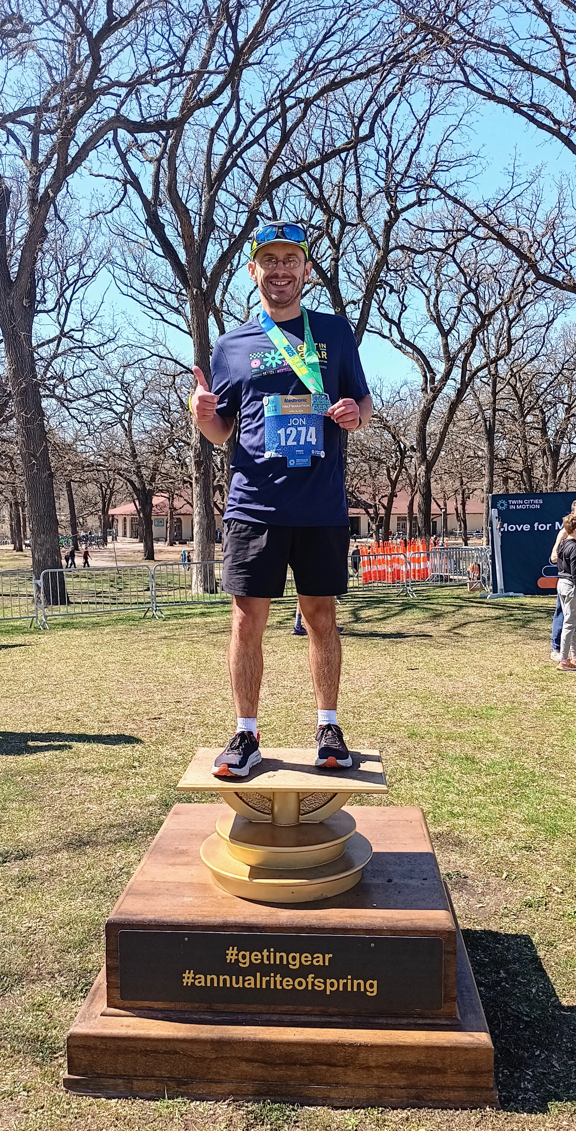Runner posing on a podium