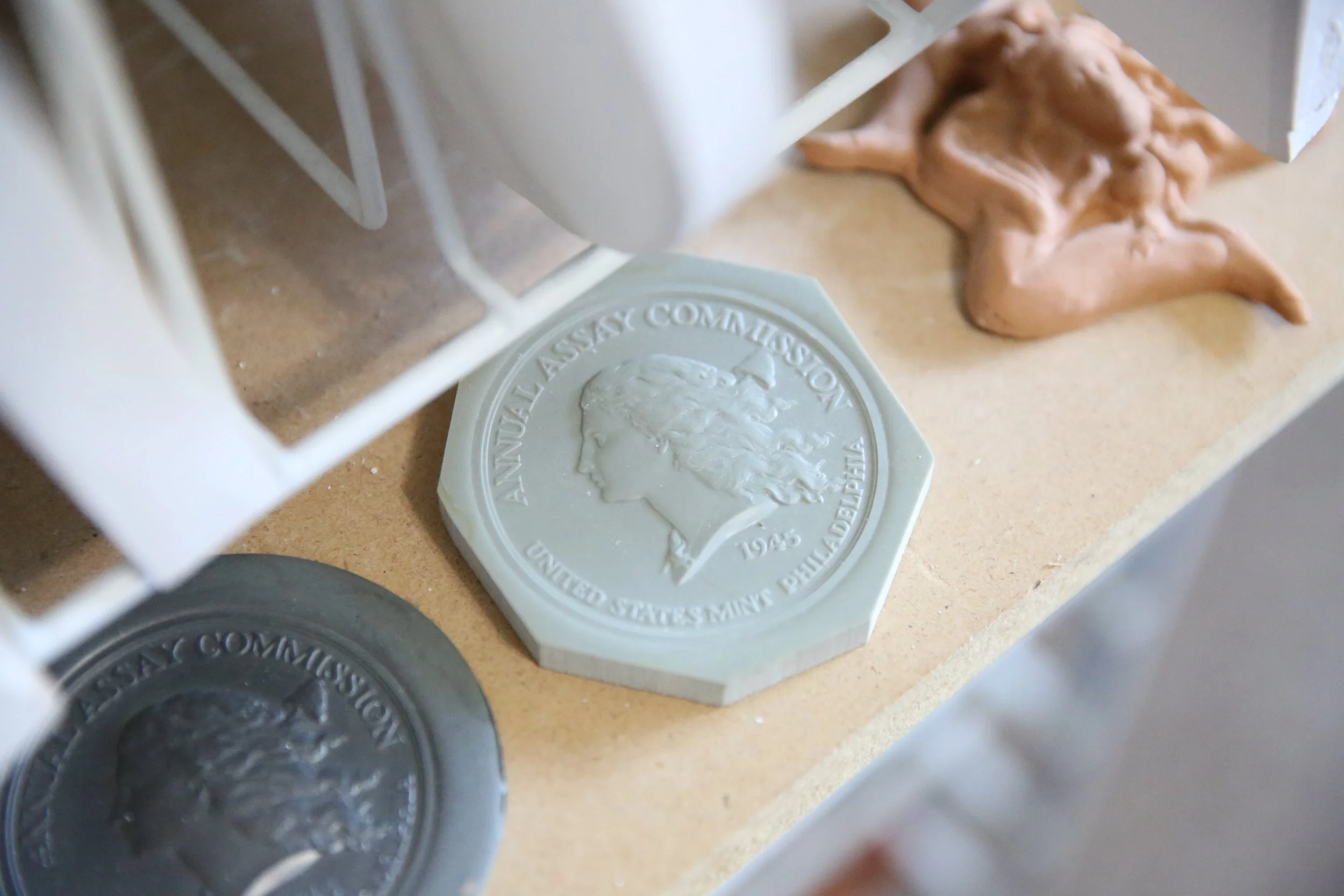 Prototype relief model featuring a classic Liberty portrait created during the coin and medal design process, showcasing the sculptural craftsmanship behind numismatic art.