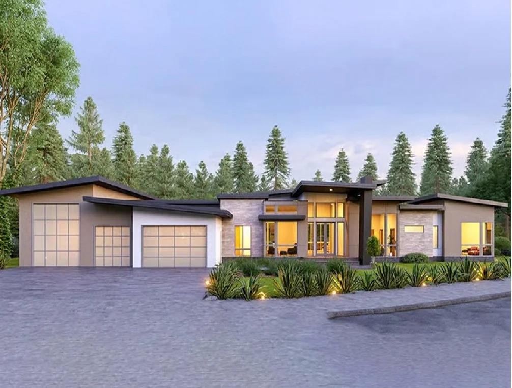 Modern single-story house with large windows, a detached garage, and landscaped front yard, surrounded by trees.
