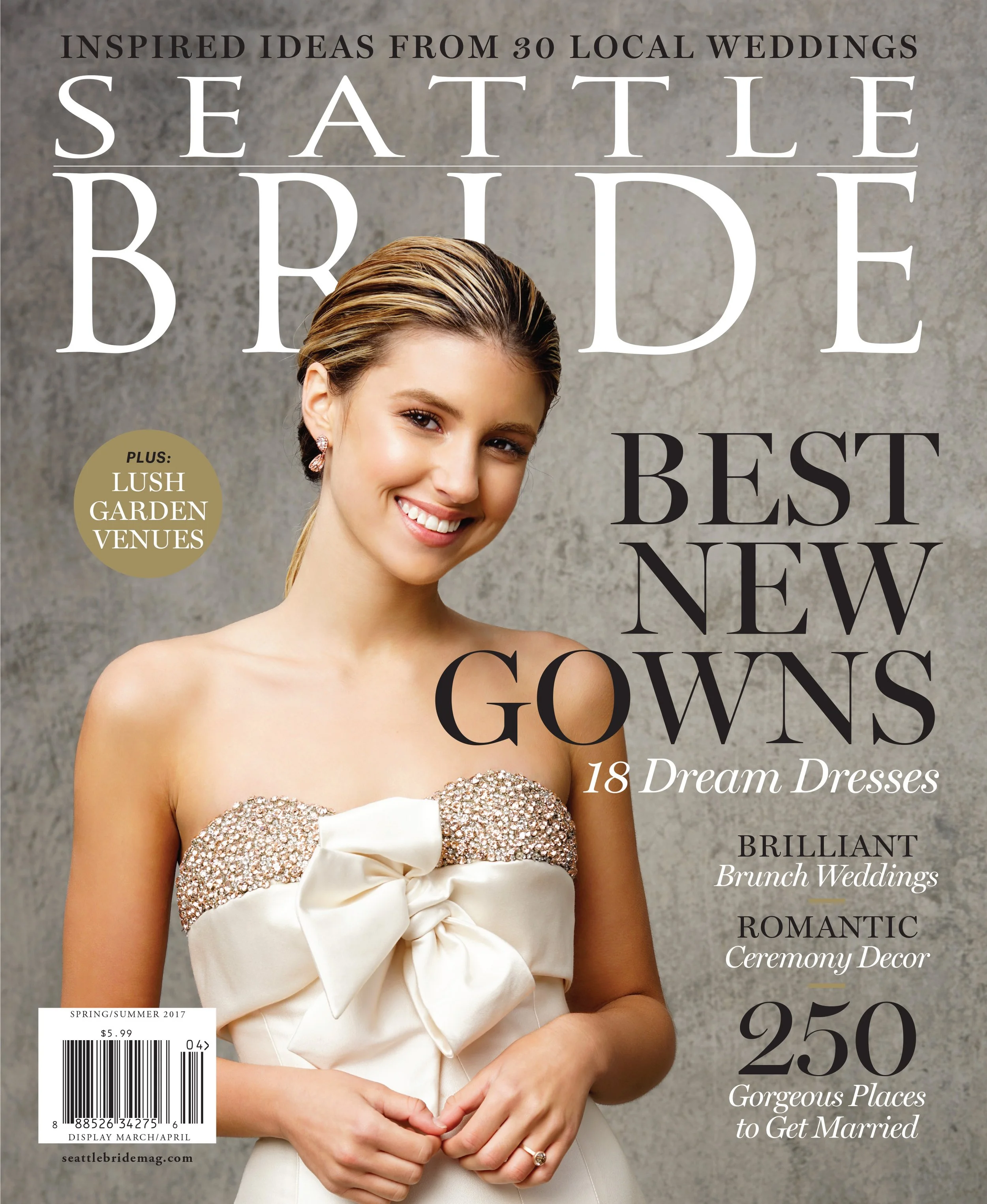 Cover of Seattle Wedding magazine featuring a smiling woman in a white strapless wedding dress decorated with sparkling beads and a large bow at the waist, against a plain gray background. The magazine headline promotes wedding ideas and destinations