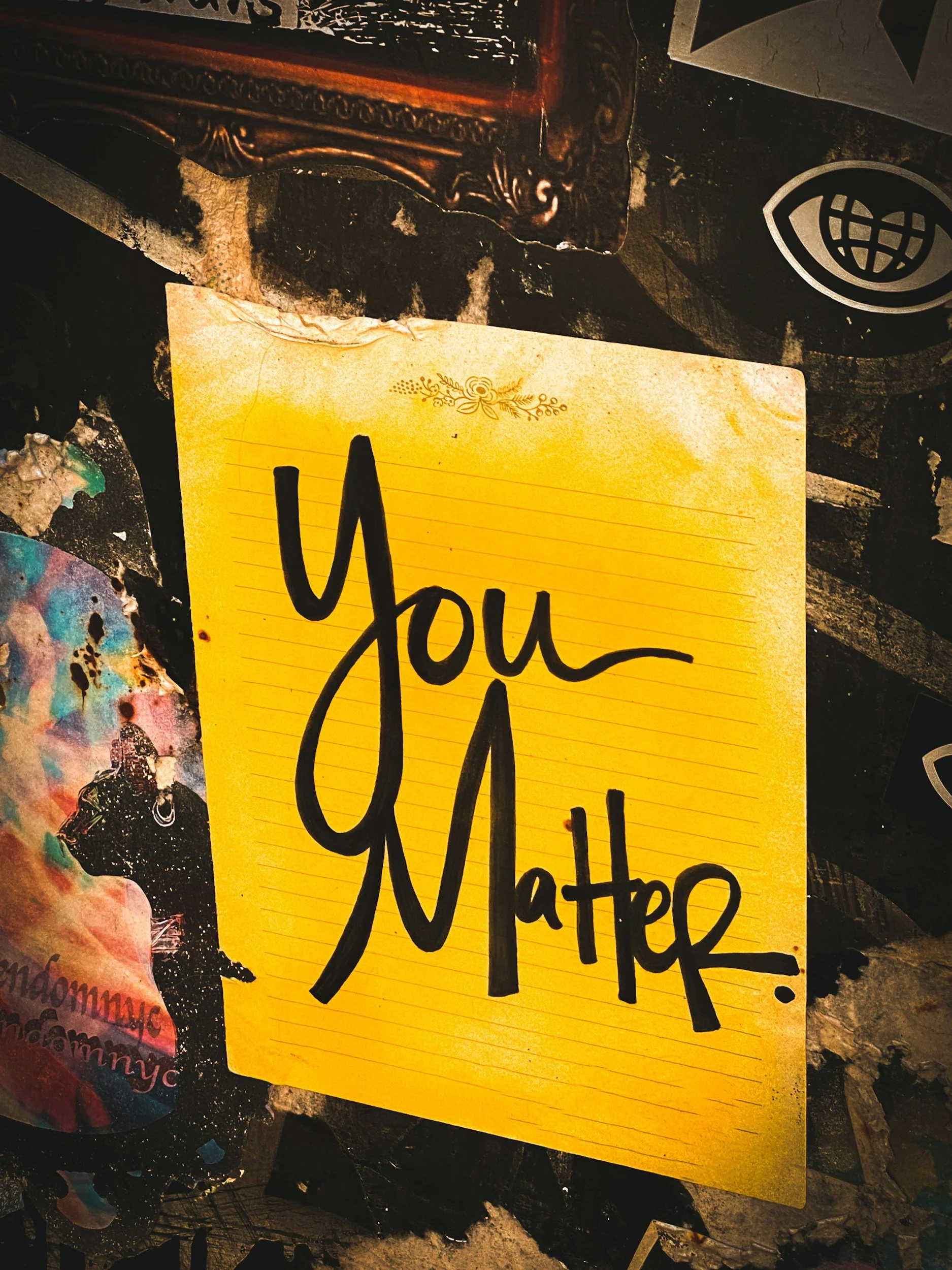 A yellow sticky note with the words "You Matter" written in bold black letters.