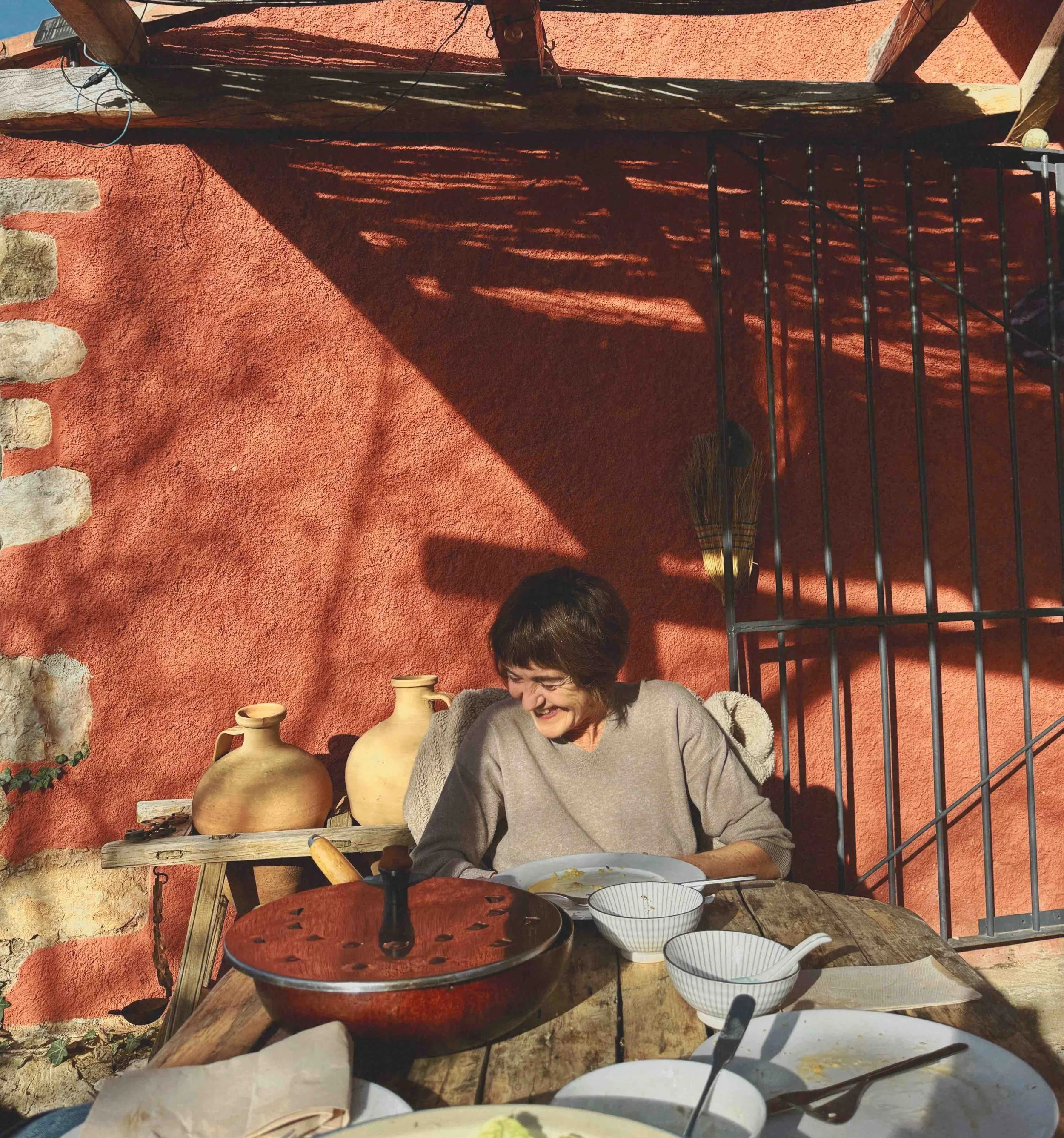 Woman, Beatriz Fernandez laughing at a lunch table