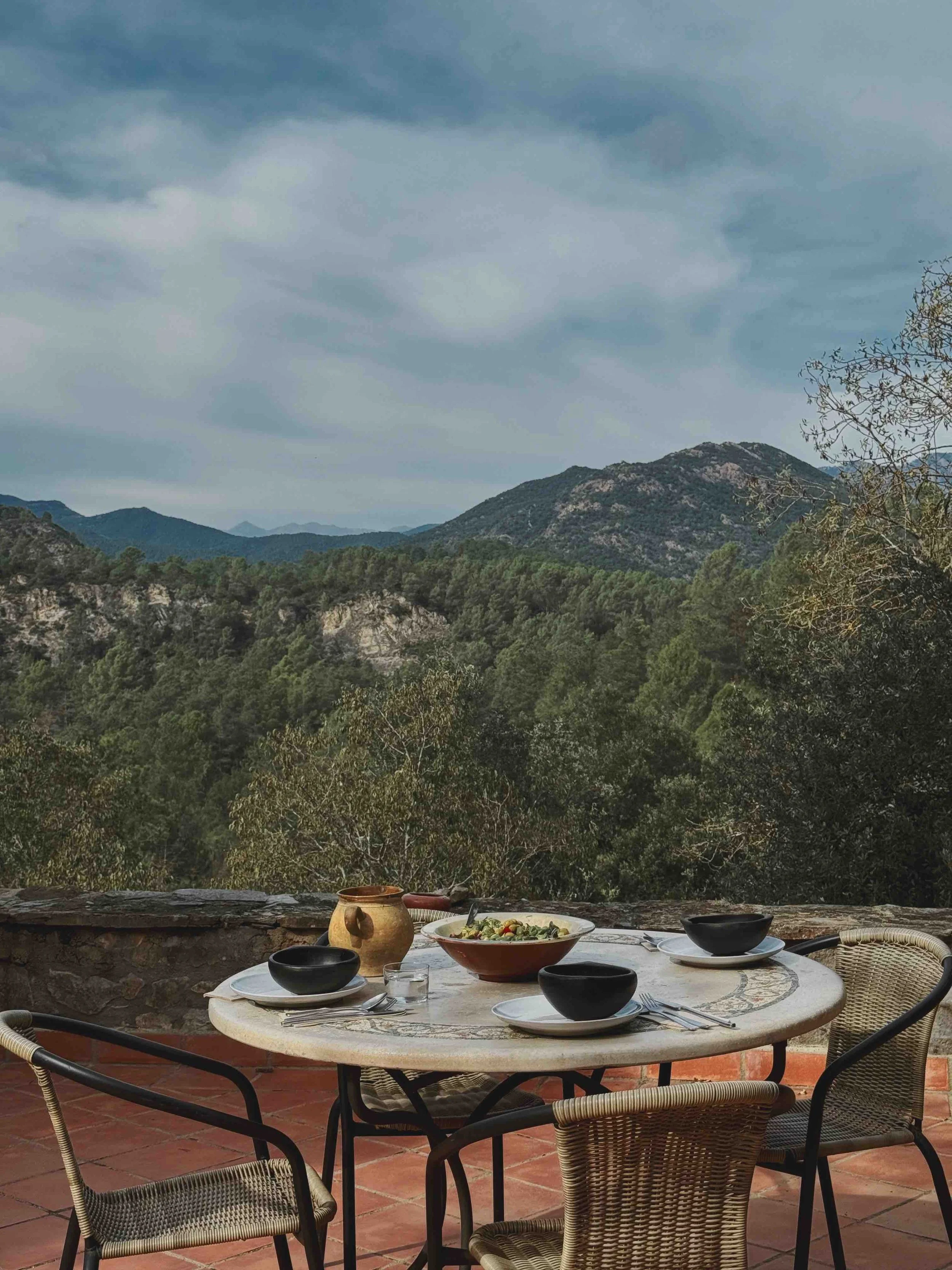 Lunch setting on a balcony surrounded by nature