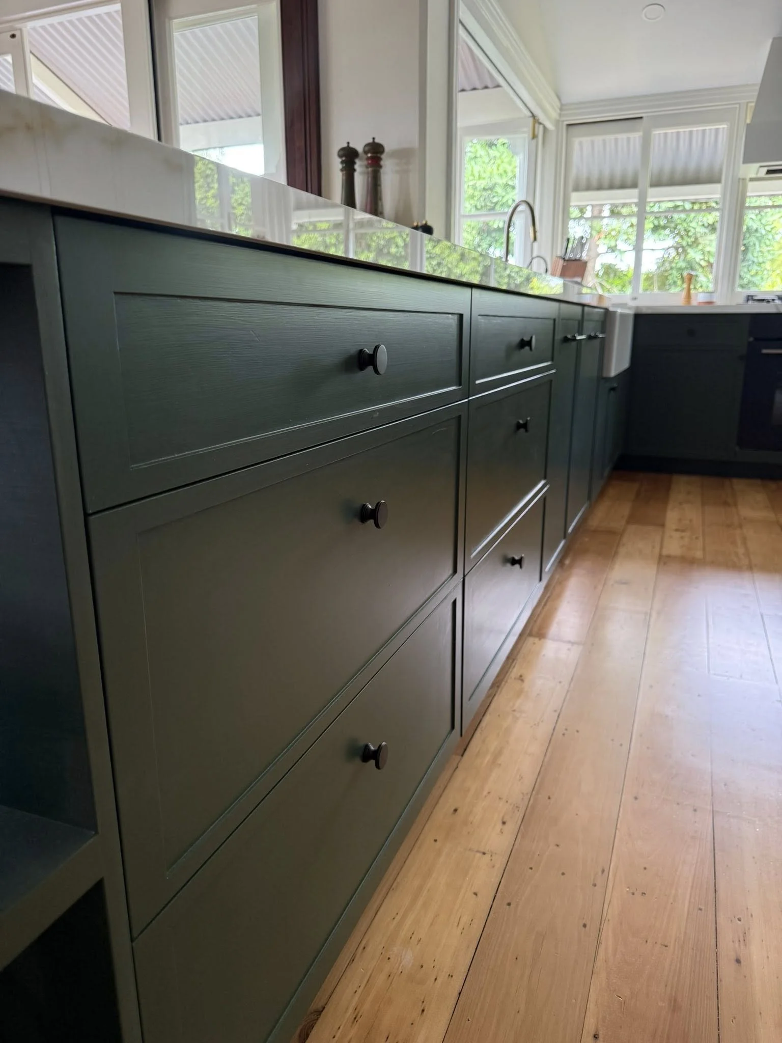 Kitchen cabinet repaint completed in North Brisbane by SJR Painting.