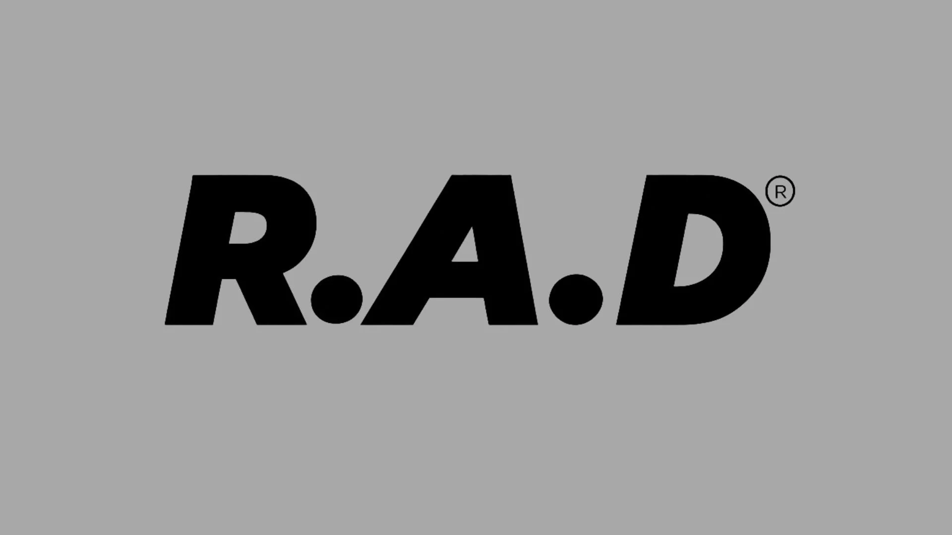 Black bold text 'R•A•D' on a gray background with a registered trademark symbol near the letter D.