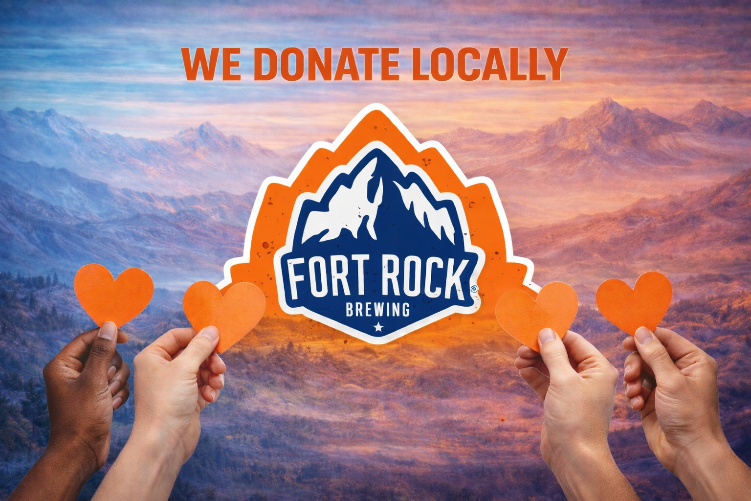 Multiple hands holding orange paper hearts in front of a mountain landscape with a logo for Fort Rock Brewing and the text 'We Donate Locally'.
