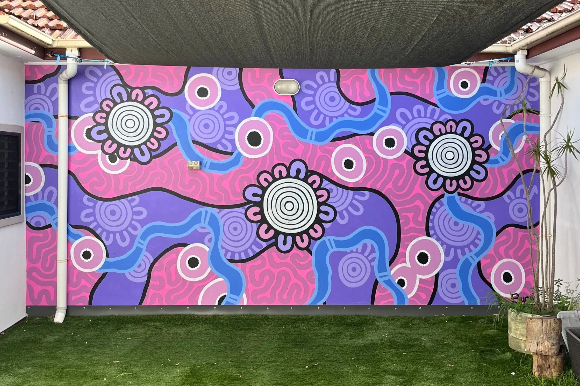 Aboriginal mural artist Bunjil Art creating custom murals across Australia