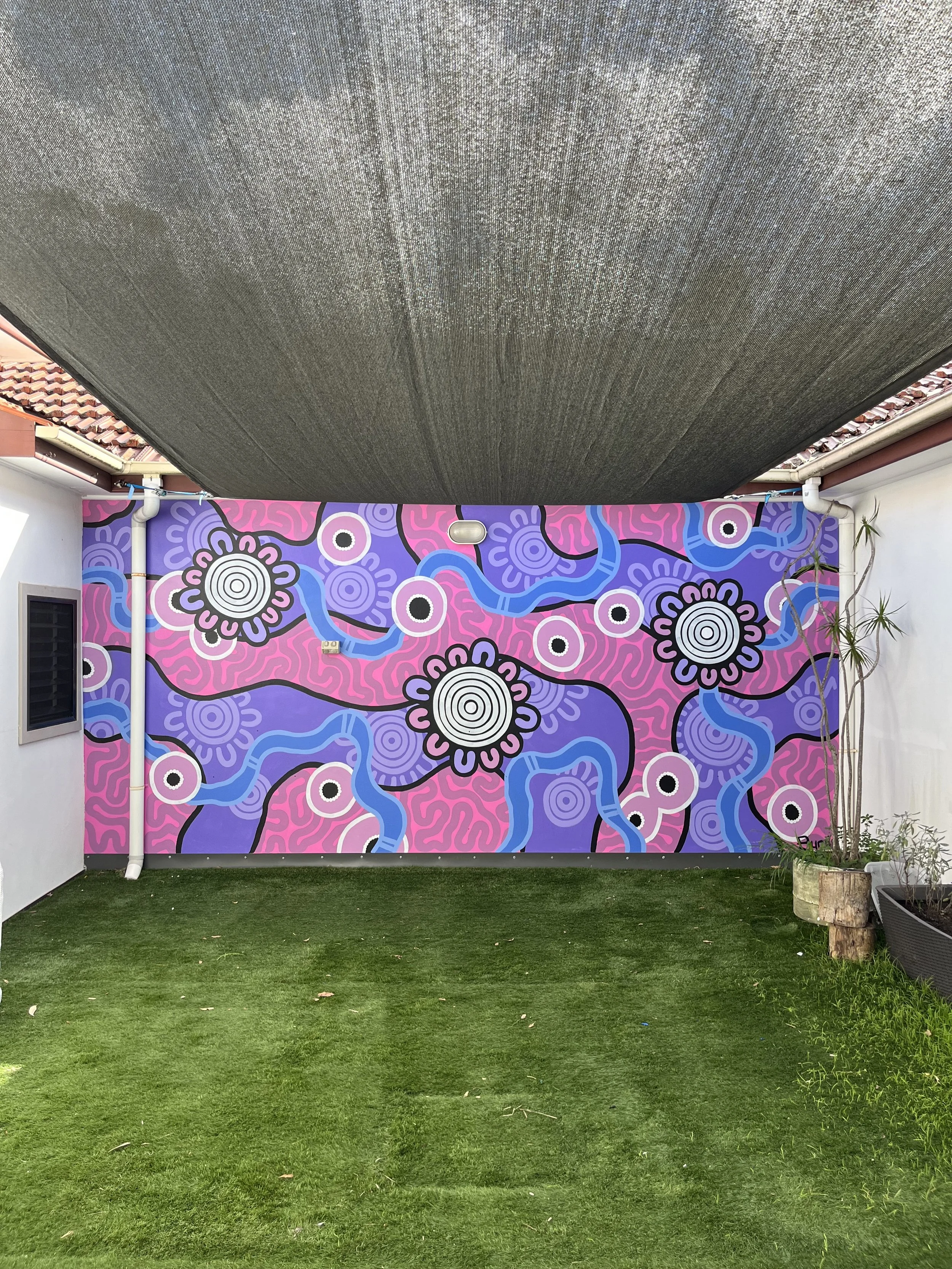 Aboriginal mural artist Bunjil Art creating custom murals across Australia