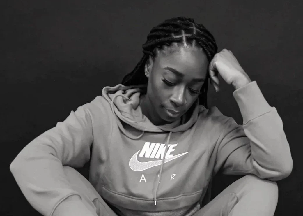 Rashida Saunders, keynote speaker and trauma informed leadership voice, in a reflective portrait representing strength, vulnerability, and emotional resilience.