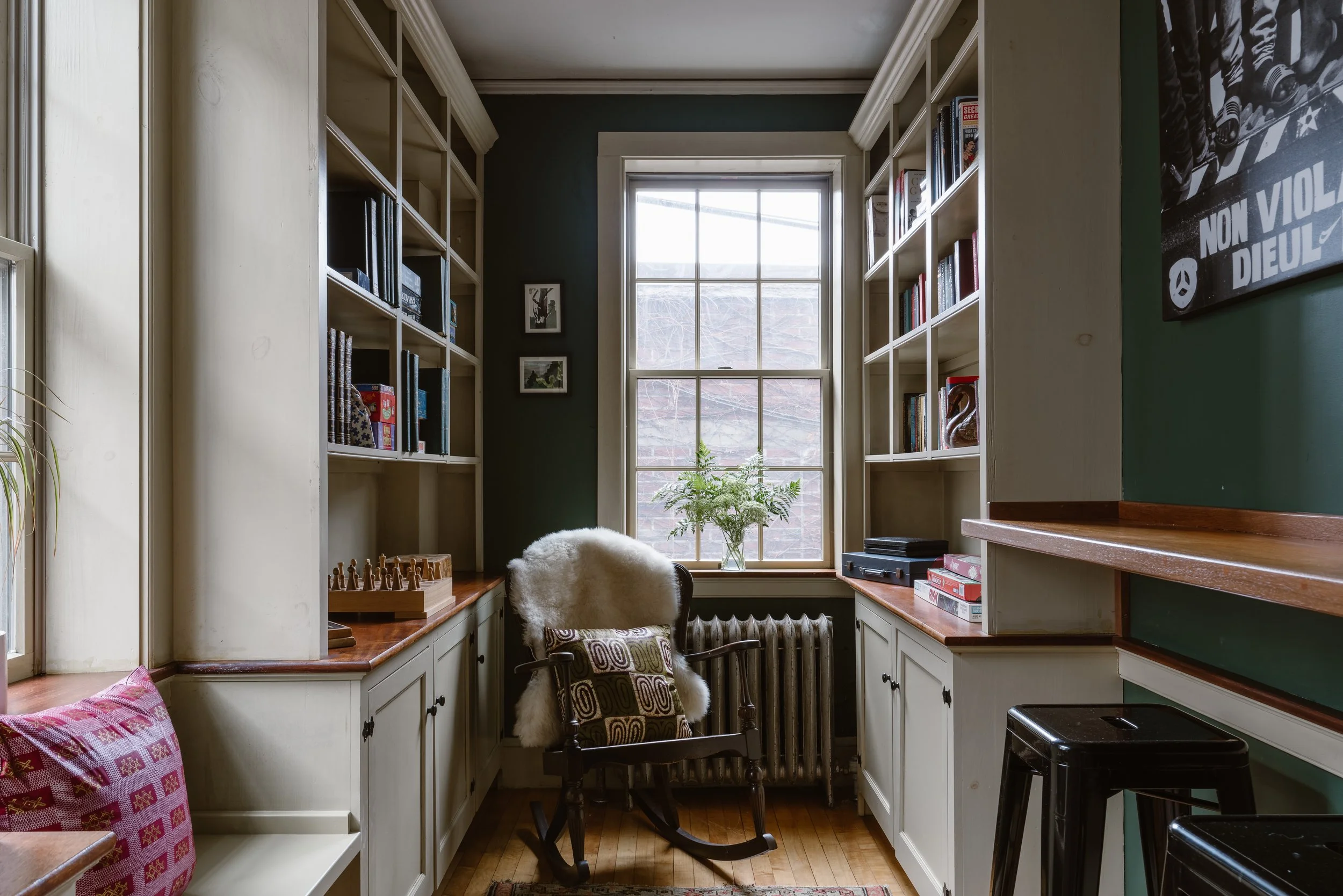 Hotel library with rocking chair, books and games