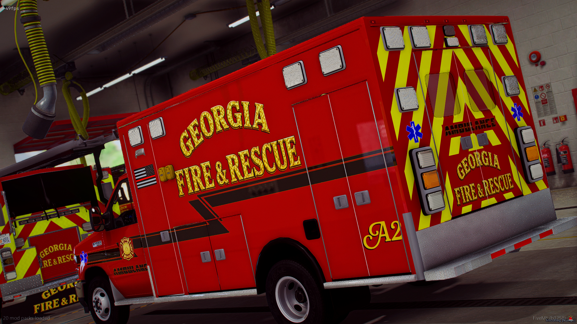 Red Georgia Fire & Rescue emergency vehicle with yellow and red chevron pattern and blue star of life symbols, parked indoors with fire extinguishers and firefighting equipment visible.