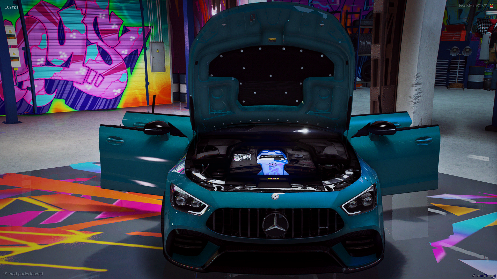 A blue Mercedes-Benz car with its hood open, inside a vibrant garage with colorful graffiti art on the wall.