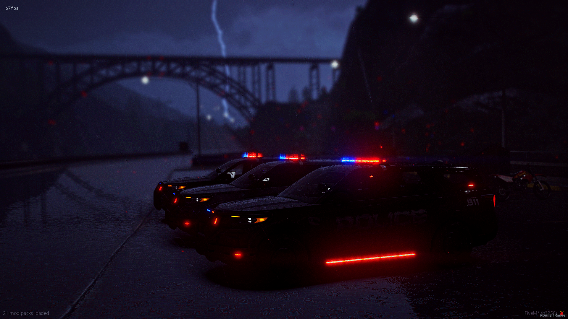 Night scene with police cars and a motorcycle parked near a body of water, with a lightning bolt in a cloudy sky and an arched bridge in the background.