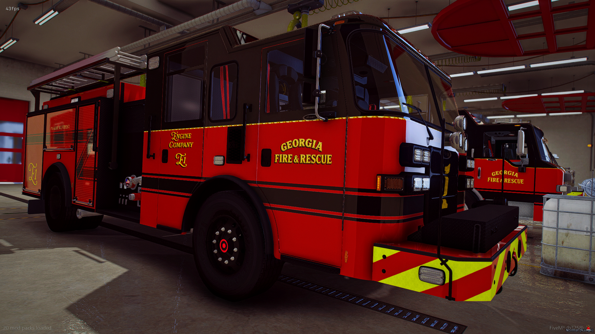 Red Georgia fire rescue fire truck inside a garage with equipment nearby.